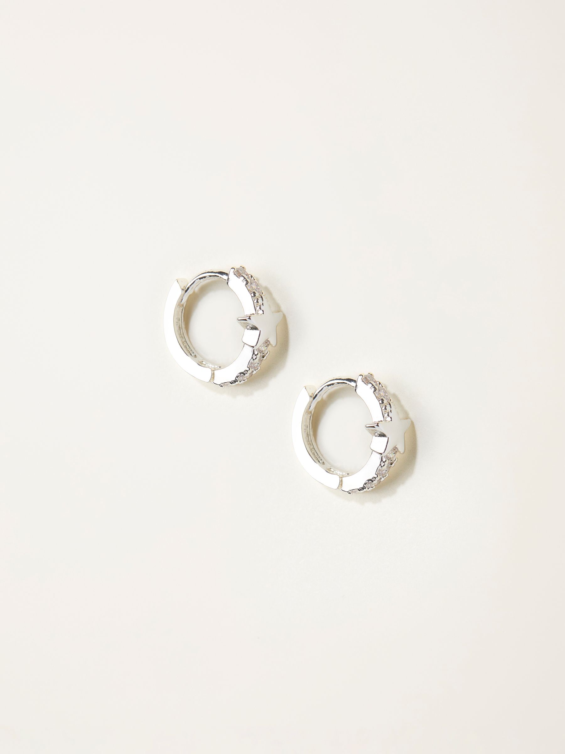 Silver Tone Star Huggie Earrings - Image 1 of 2