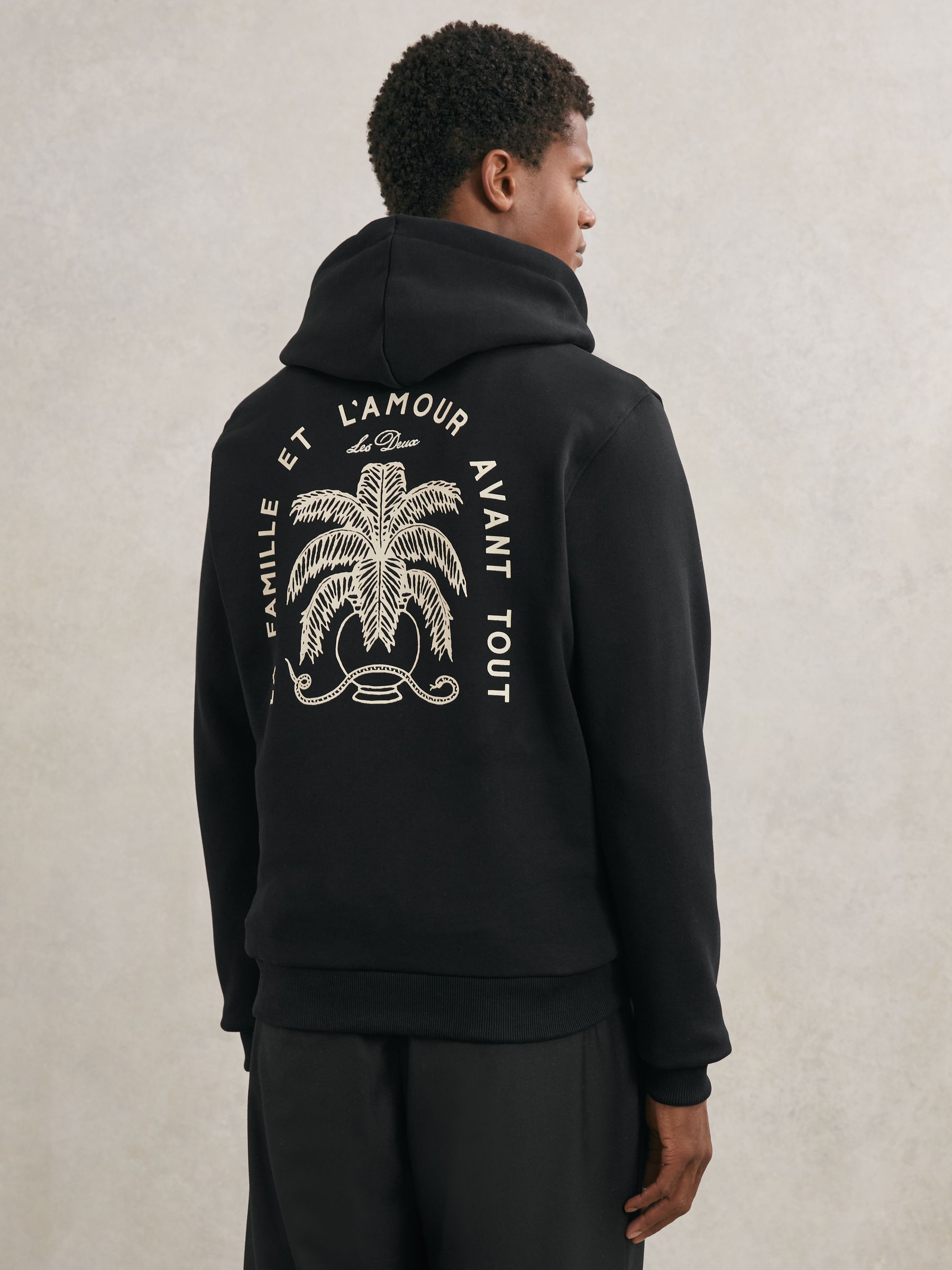 Les Deux Cotton Artwork-Print Hoodie in Black - Image 1 of 5 Les Deux Cotton Artwork-Print Hoodie in Black - Image 1 of 5