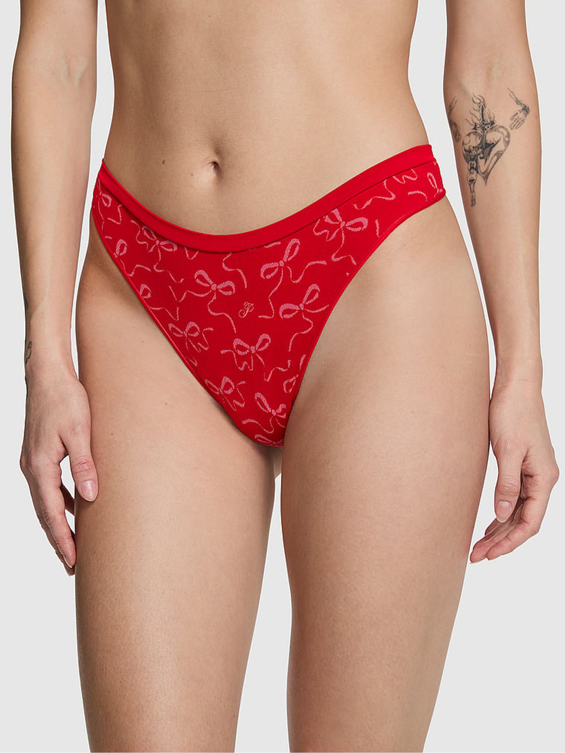 Bright Vermillion Red Bow Print Thong Seamless Knickers - Image 1 of 2 Bright Vermillion Red Bow Print Thong Seamless Knickers - Image 1 of 2