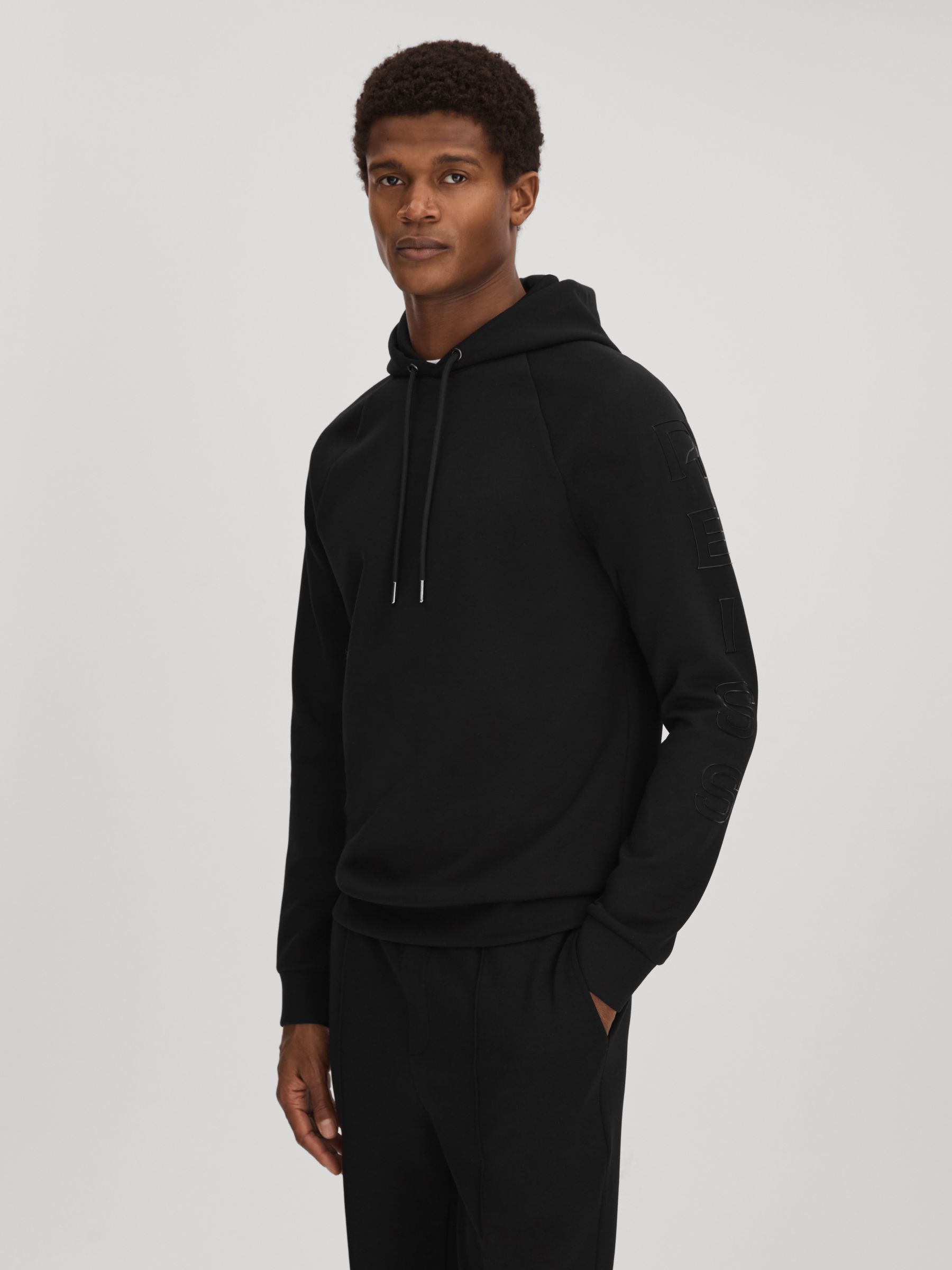Interlock Jersey Hoodie in Black - Image 1 of 7