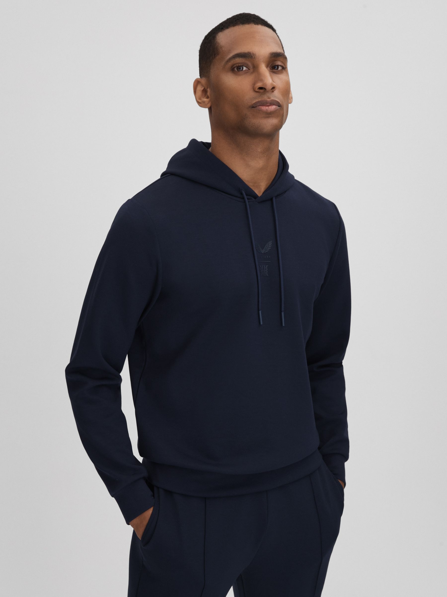 Castore Jersey Drawstring Hoodie in Midnight Navy - Image 1 of 7 Castore Jersey Drawstring Hoodie in Midnight Navy - Image 1 of 7