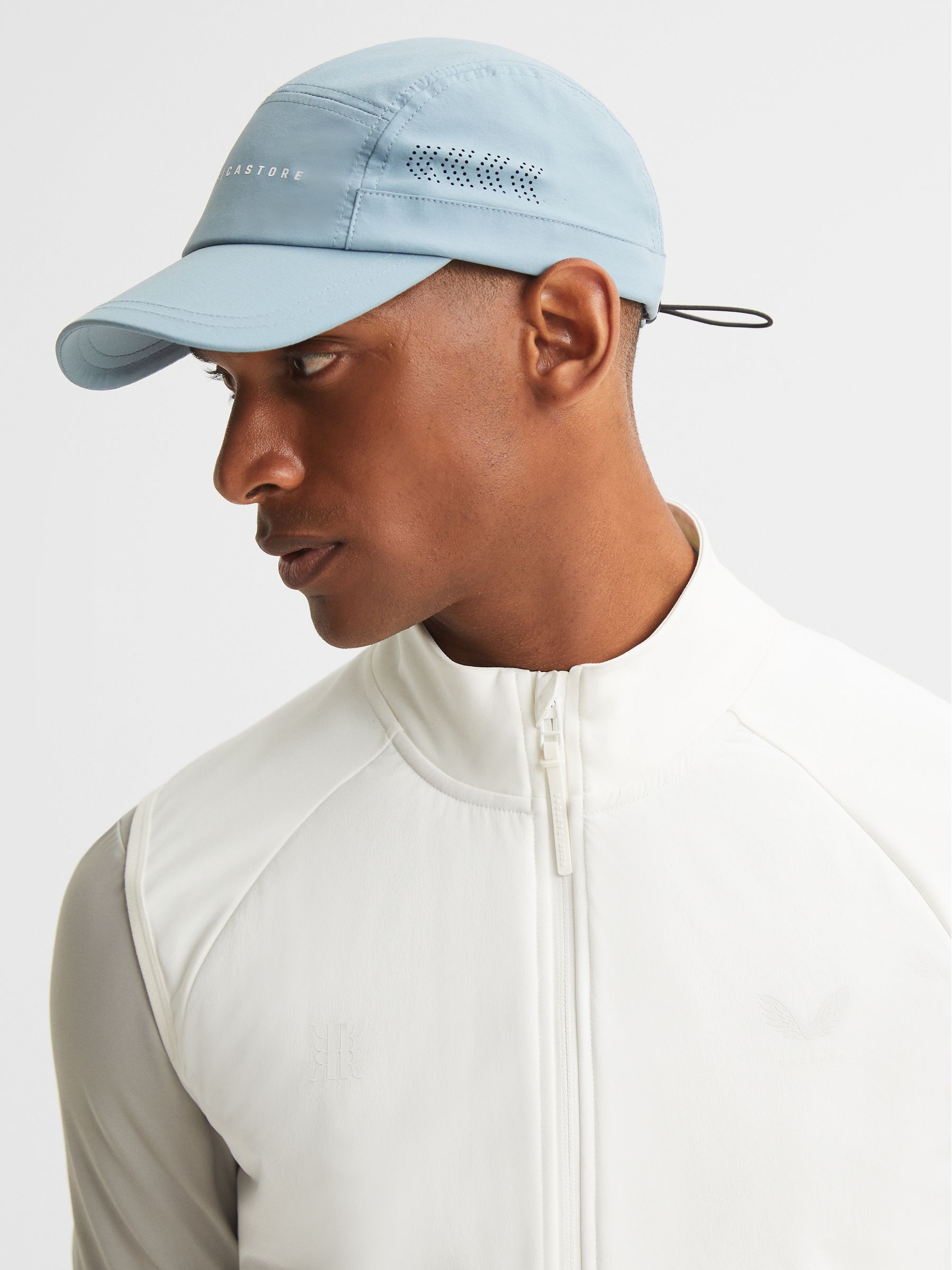 Castore Performance Flyweight Cap in Blue - Image 1 of 5 Castore Performance Flyweight Cap in Blue - Image 1 of 5