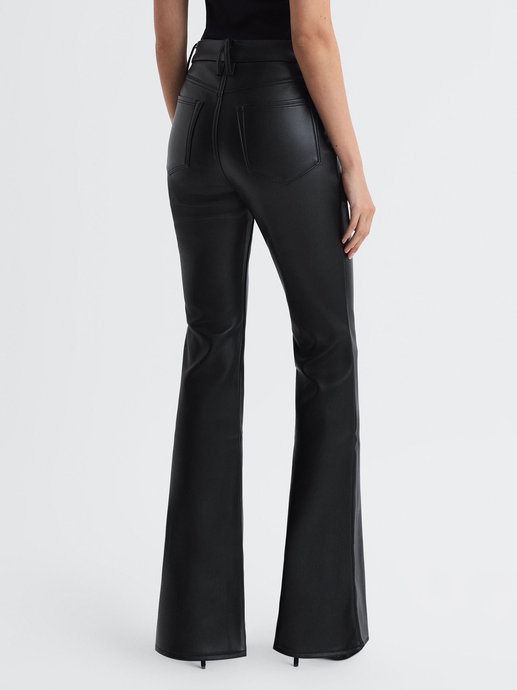 Reiss Good American Faux Leather Flared Trousers in Black | REISS