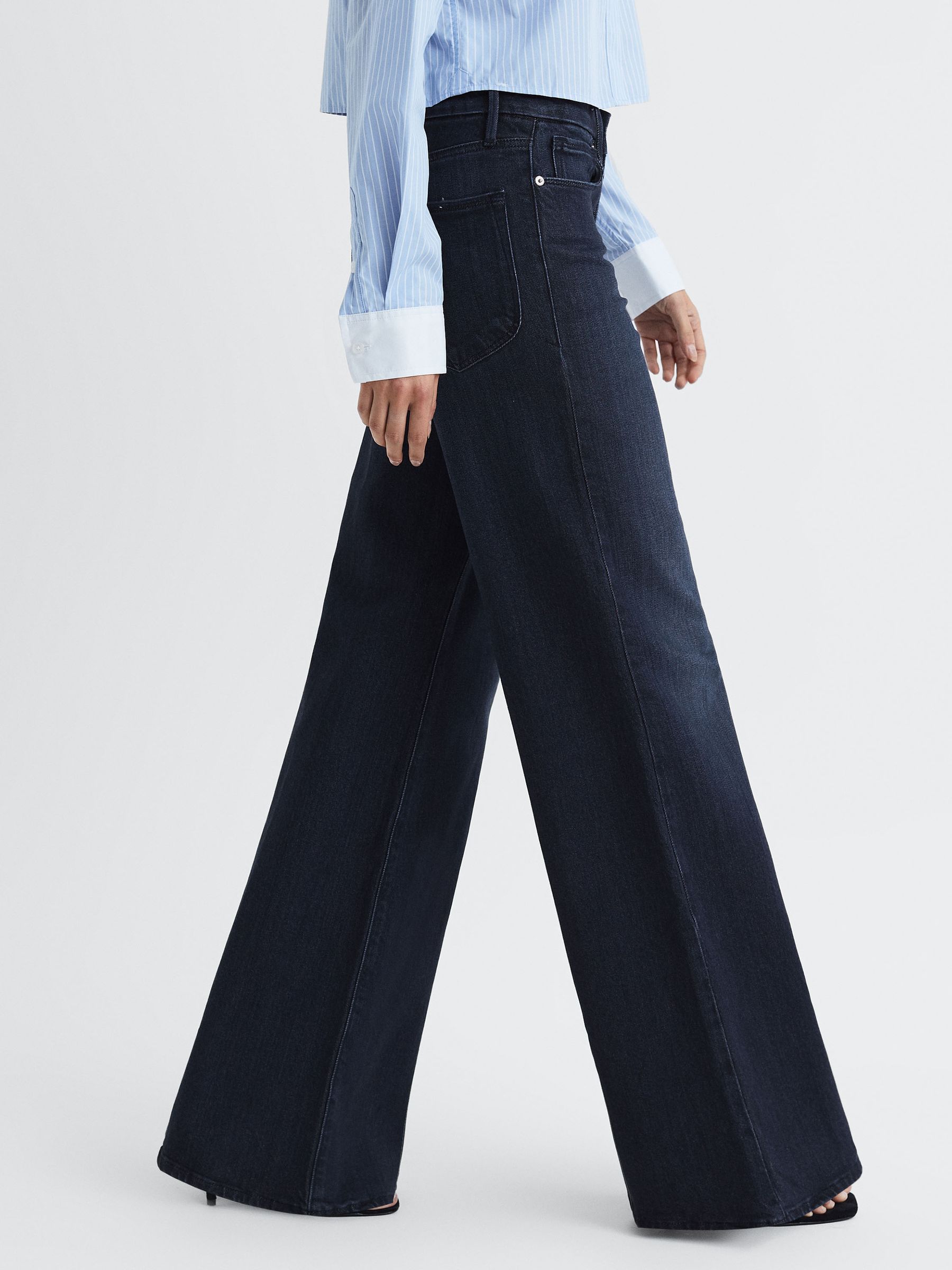 Good American Soft Tech Palazzo Jeans in Indigo - Image 1 of 6