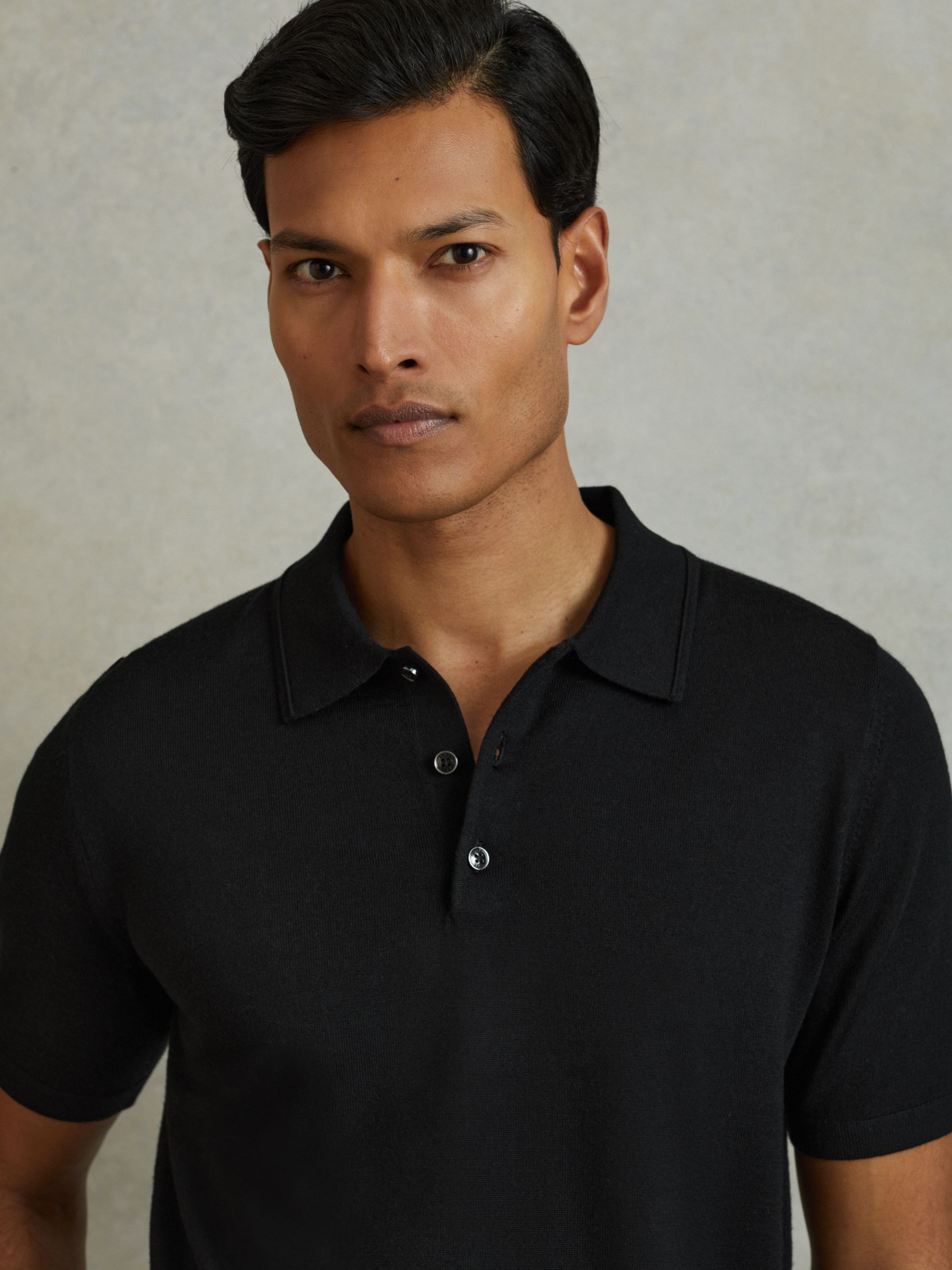Merino Wool Short-Sleeve Polo Shirt in Black - Image 1 of 6