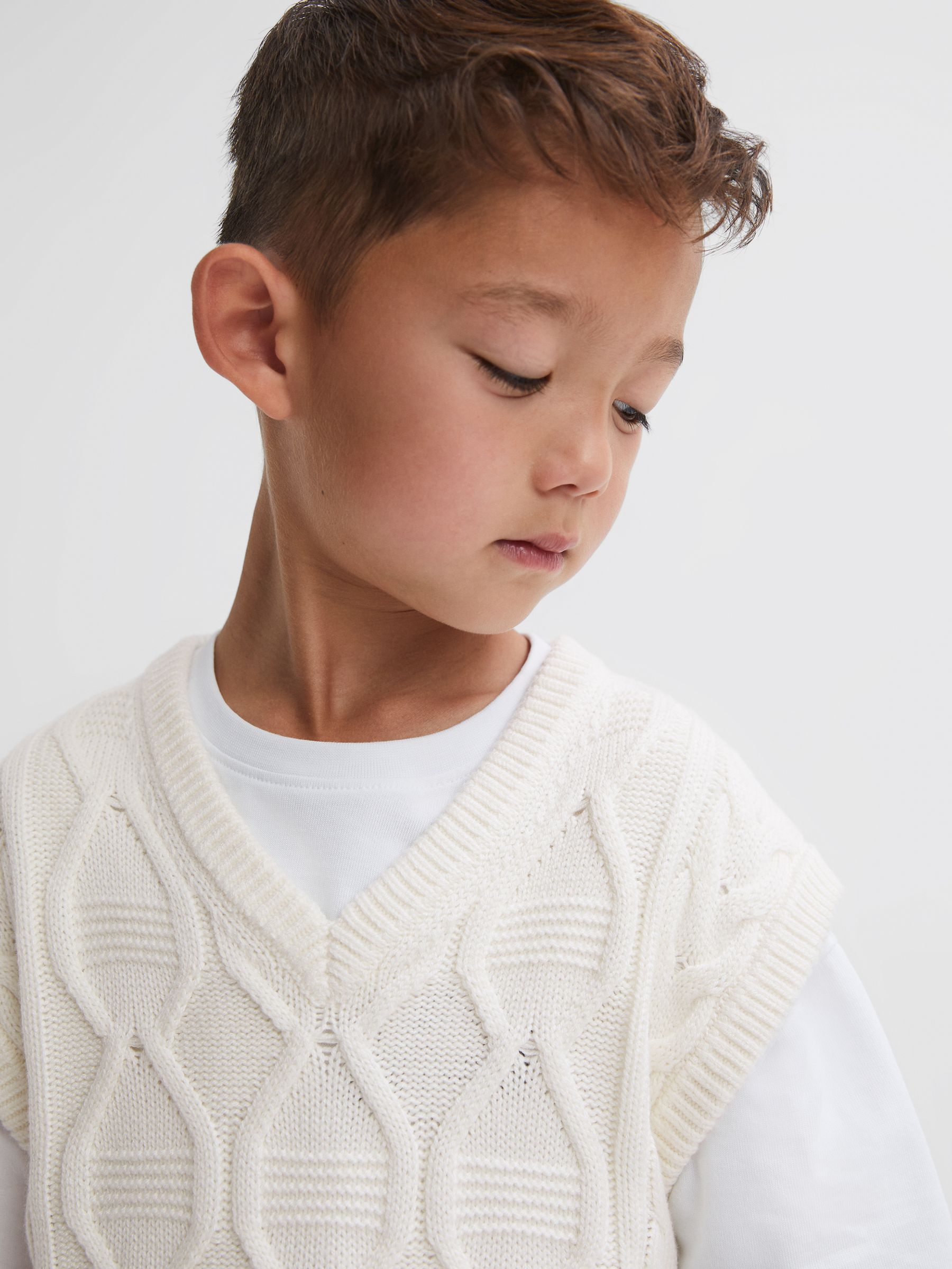 9-14 yrs Slim Fit Cable Knit Sleeveless Vest in Ecru - Image 1 of 5