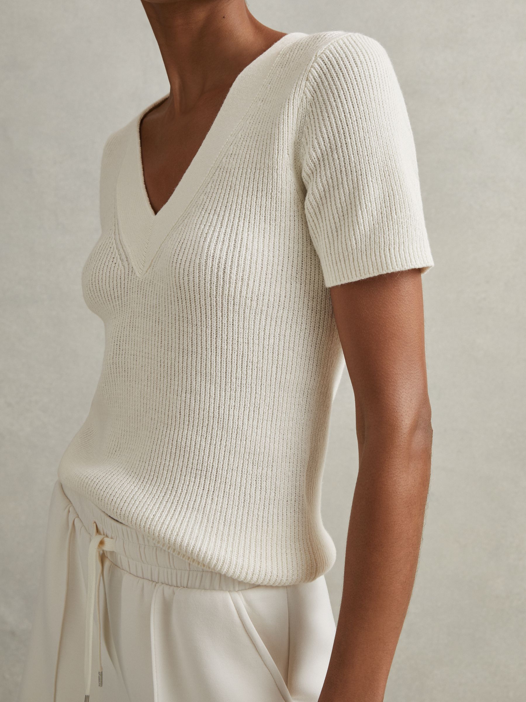 Cotton Blend Knitted V-Neck Top in Ivory - Image 1 of 6