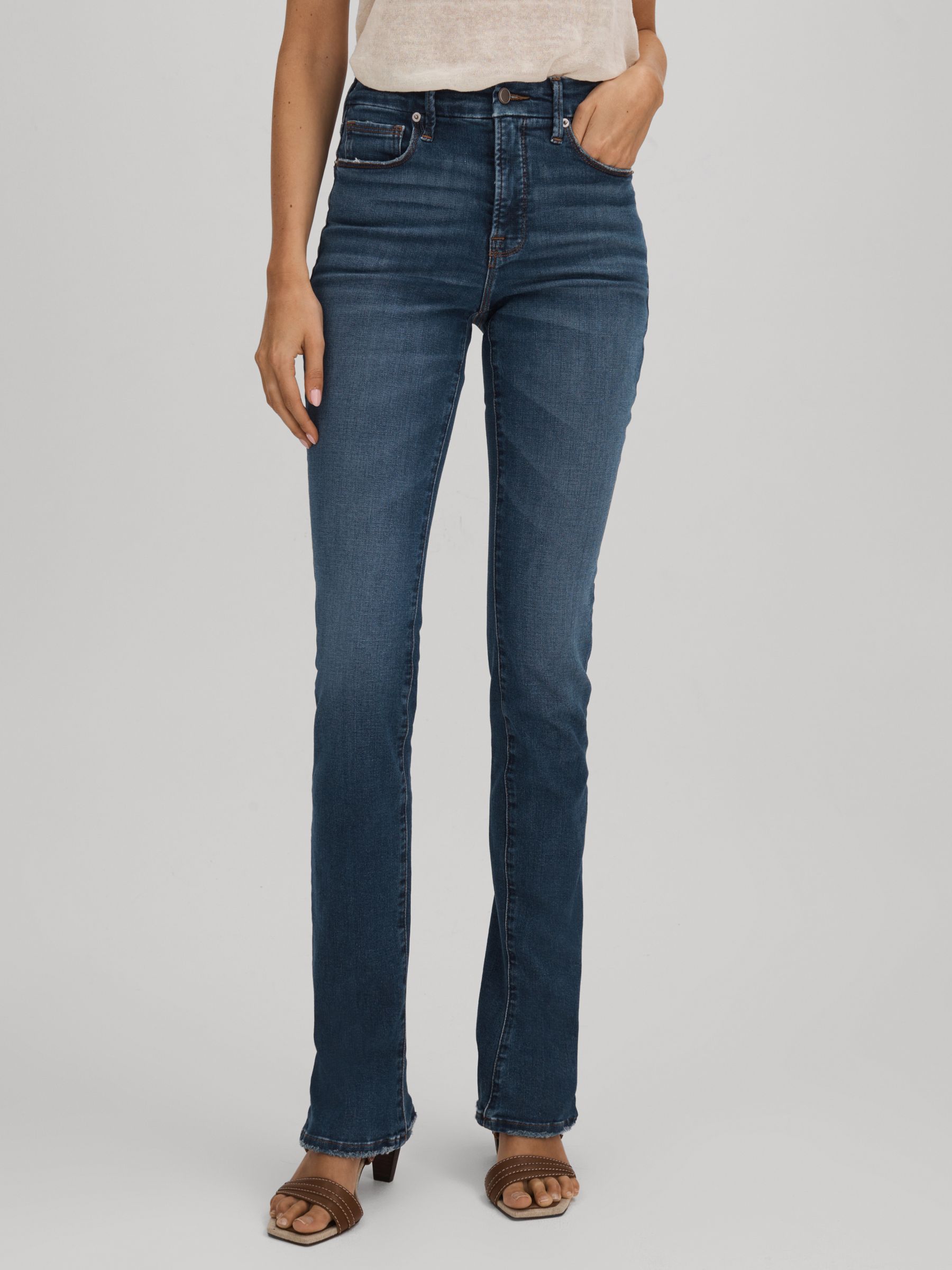 Good American Distressed Bootcut Jeans in Indigo - image 3