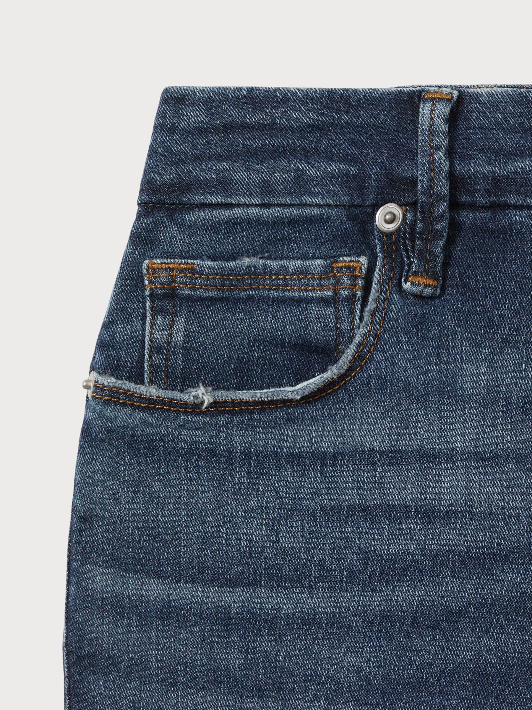 Good American Distressed Bootcut Jeans in Indigo - image 5