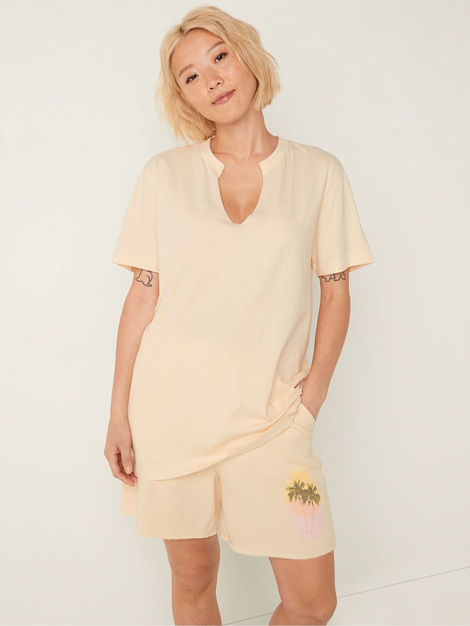 Light Ivory Nude Campus Short Sleeve Notch Neck T-Shirt - Image 1 of 4 Light Ivory Nude Campus Short Sleeve Notch Neck T-Shirt - Image 1 of 4