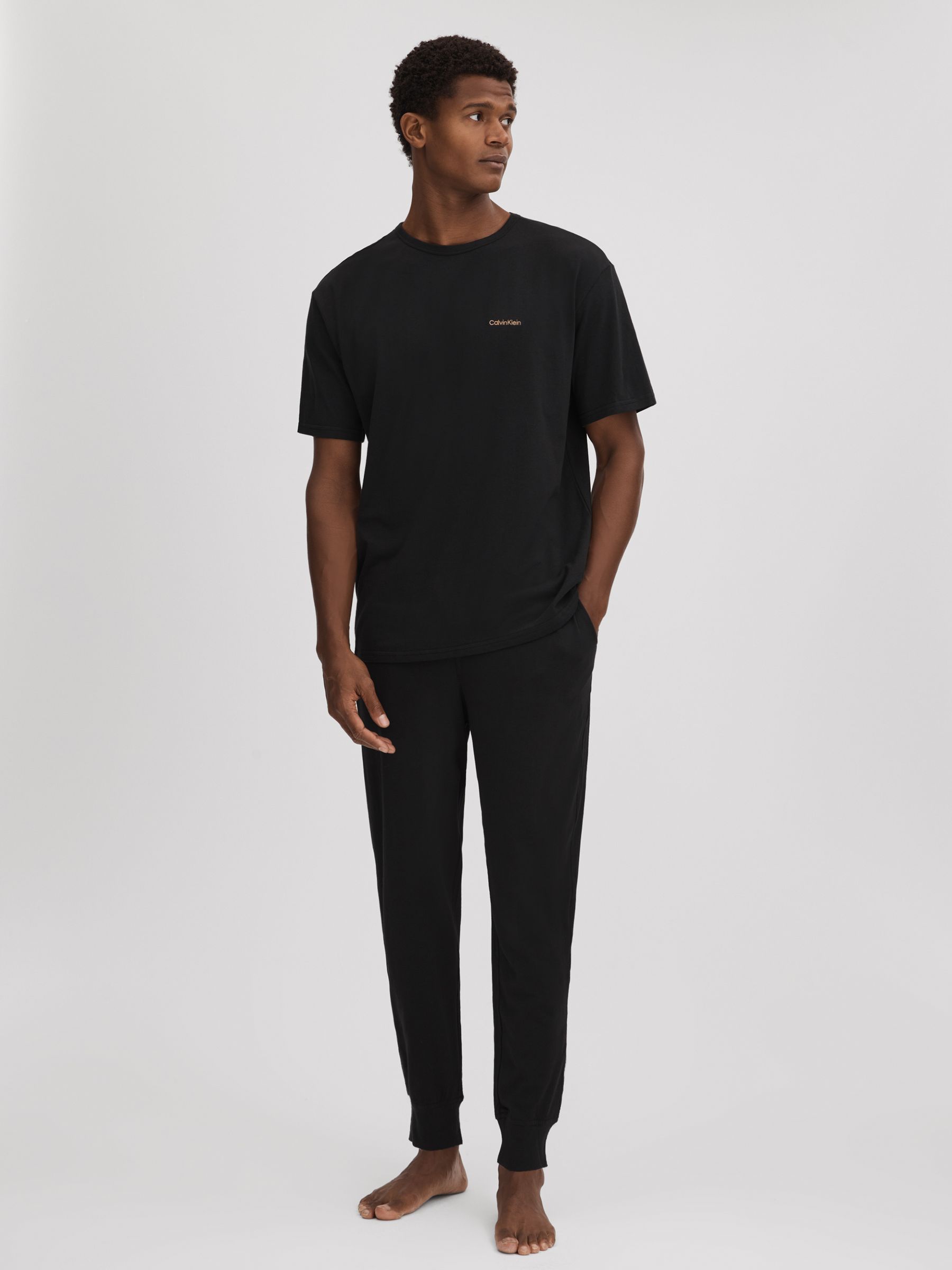 Calvin Klein Underwear T-Shirt and Joggers Set in Black - Image 1 of 6 Calvin Klein Underwear T-Shirt and Joggers Set in Black - Image 1 of 6