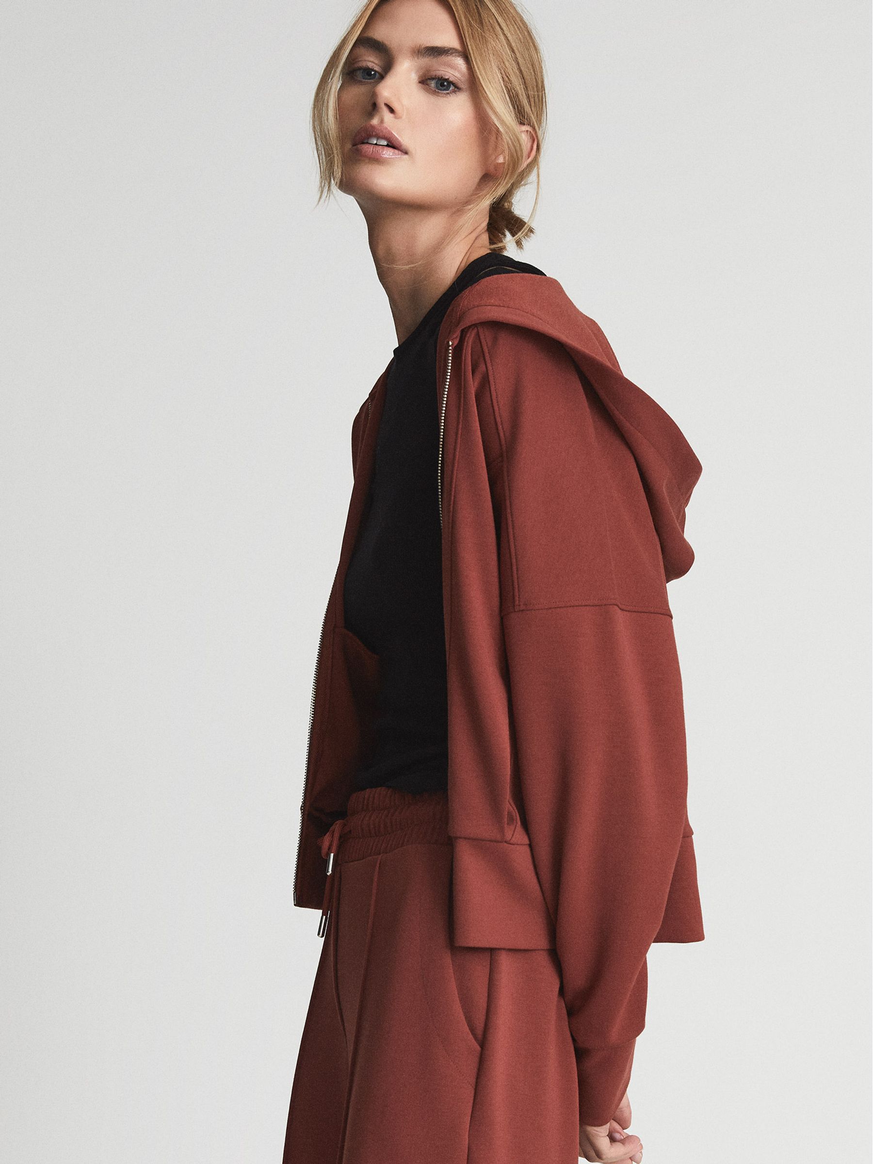 Reiss Technical Jersey Zipped Hoodie in Rust | REISS