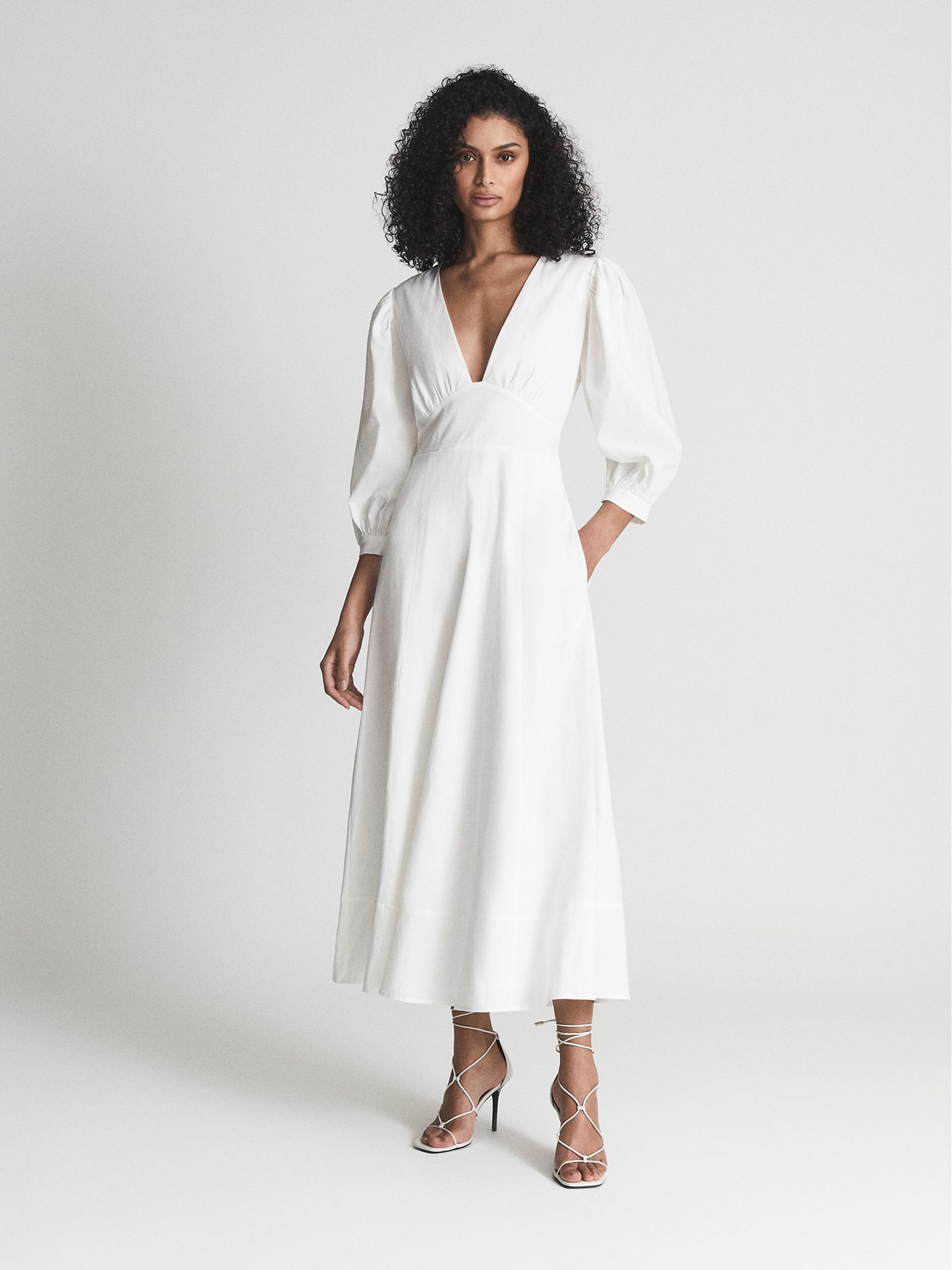 Puff Sleeve Plunge Midi Dress in White - Image 1 of 7 Puff Sleeve Plunge Midi Dress in White - Image 1 of 7