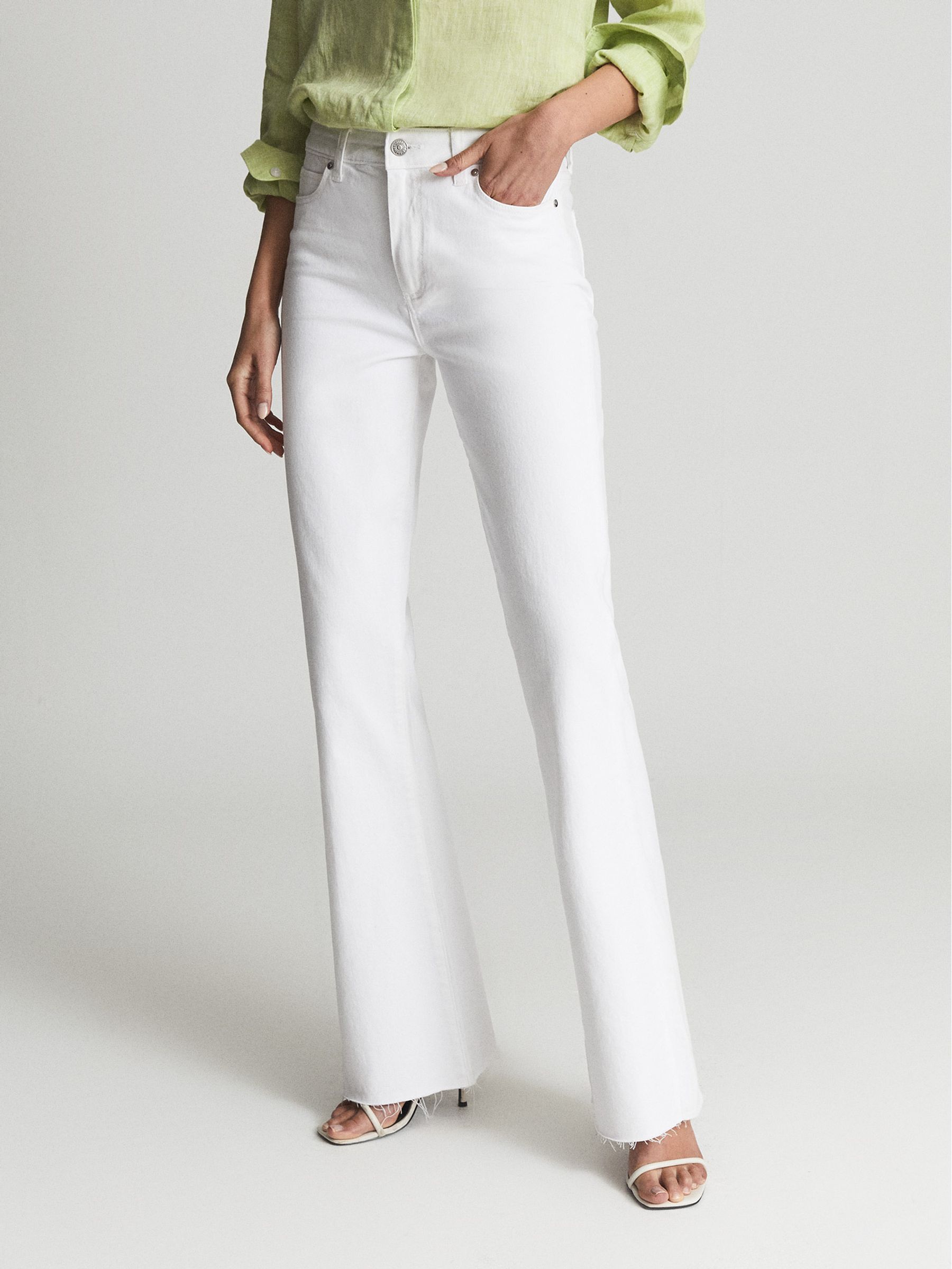 Paige High Rise Raw Hem Flared Jeans in White - Image 4 of 8