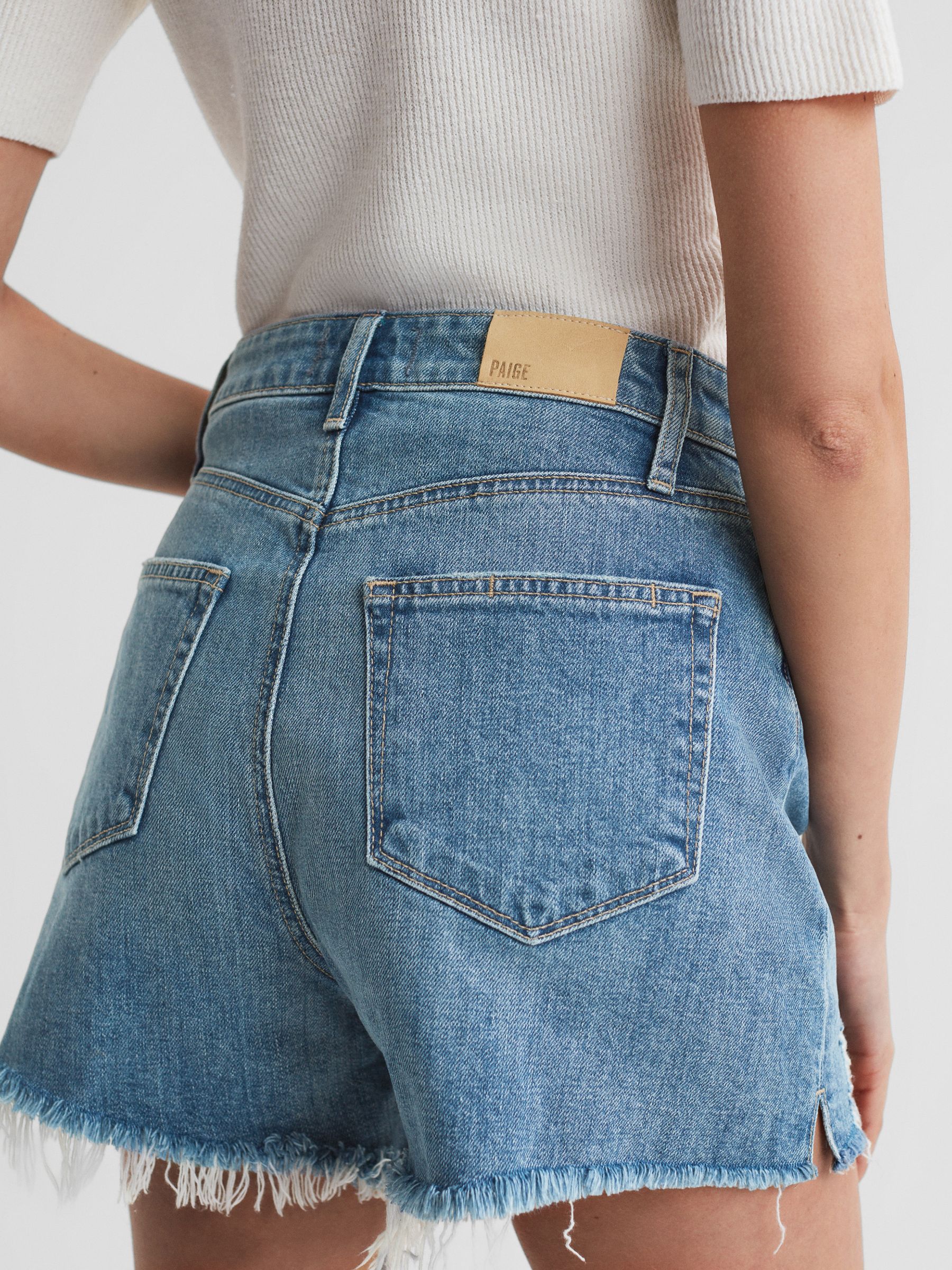 Paige Raw Hem Denim Shorts in Mid Blue - image 4