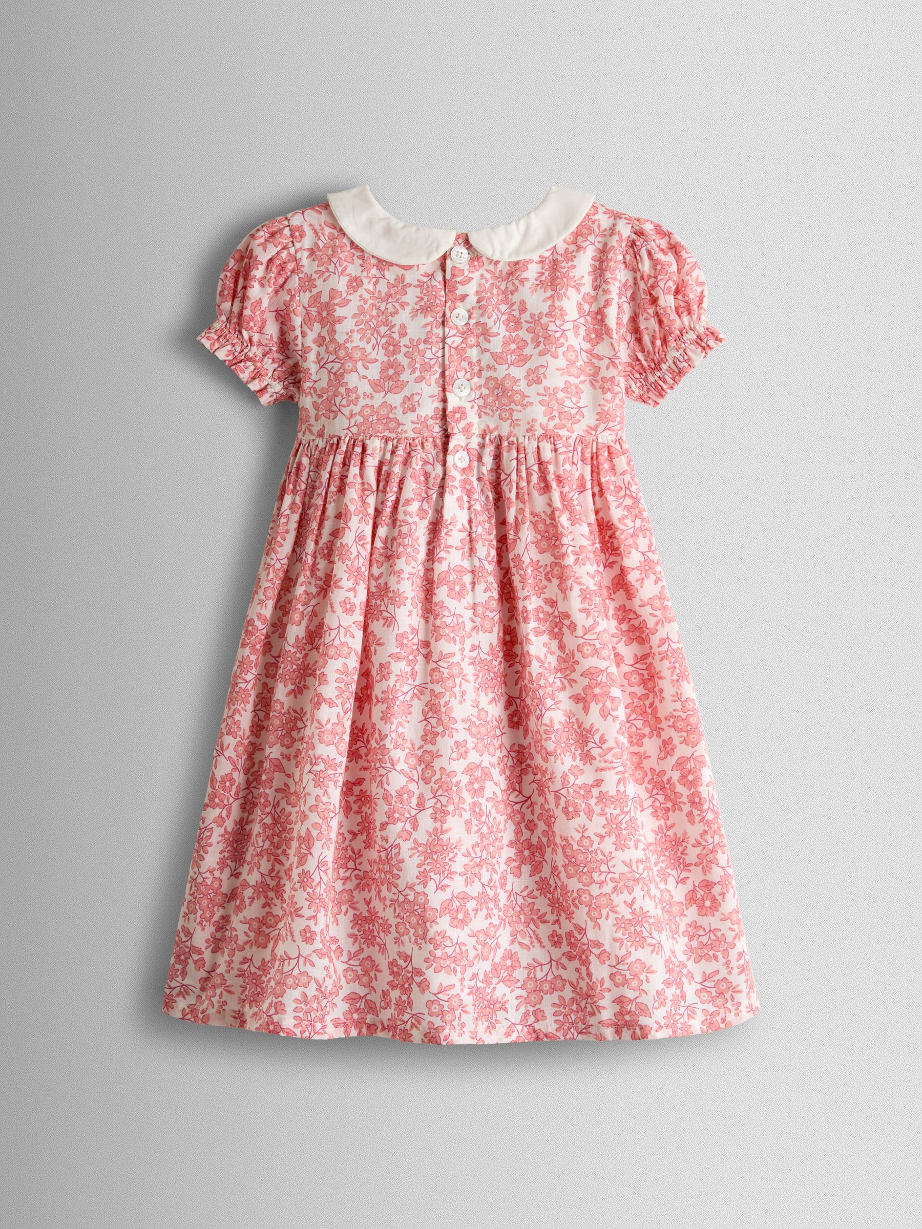light pink smock dress The Bryan Smocked Midi Dress in Pale Pink Large