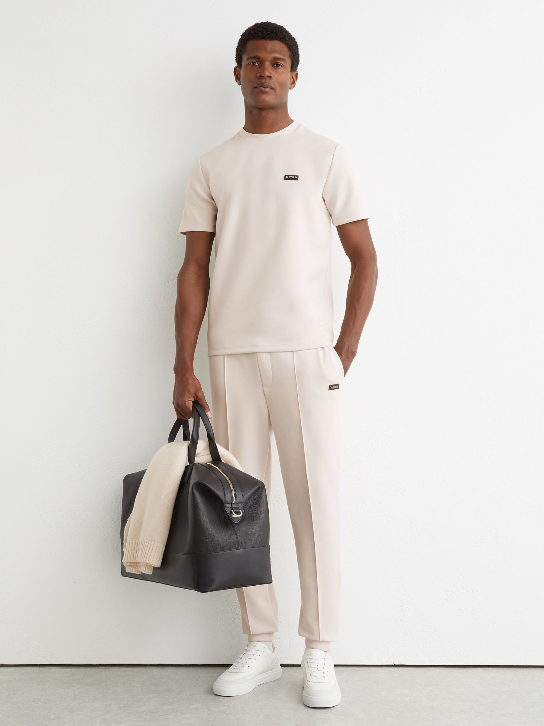Premium Interlock Cuffed Logo Joggers in Off White - image 2