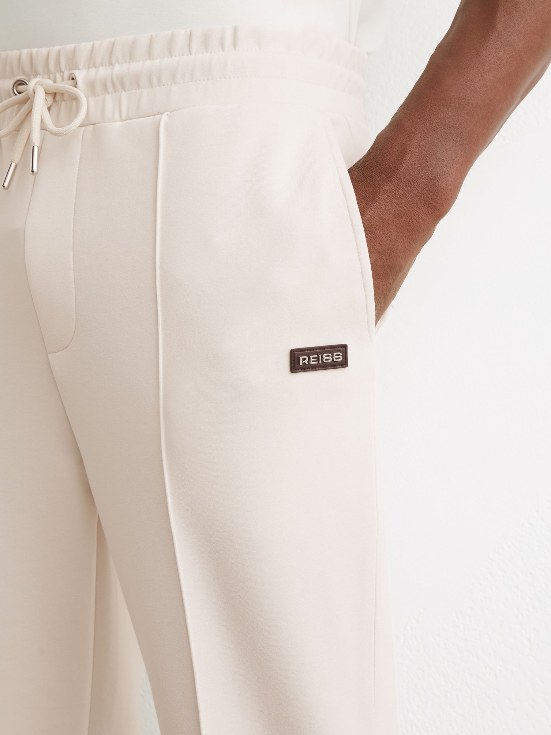 Premium Interlock Cuffed Logo Joggers in Off White - image 5