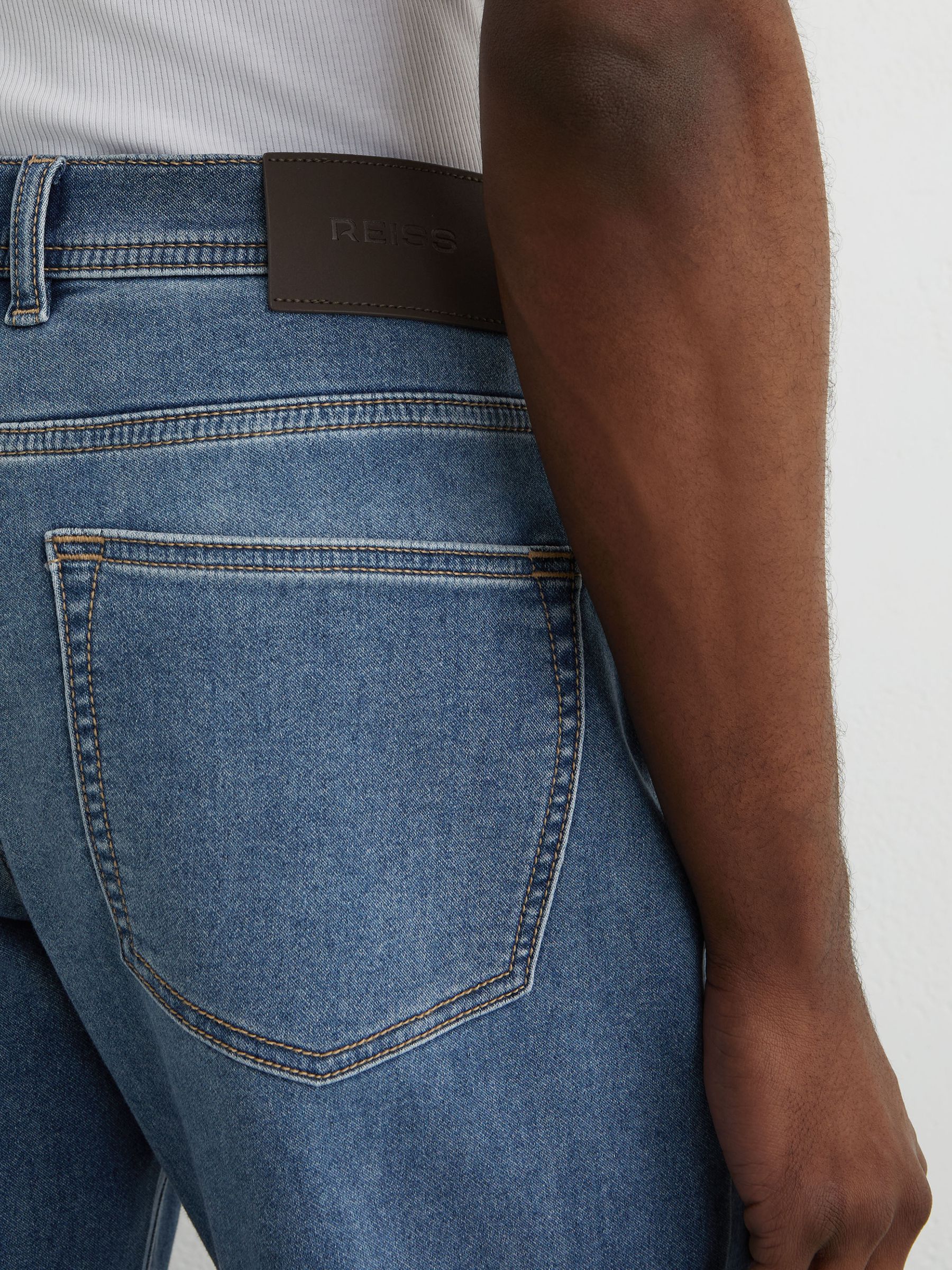 Soft-Stretch Straight-Leg Jeans in Light Wash Blue - image 4