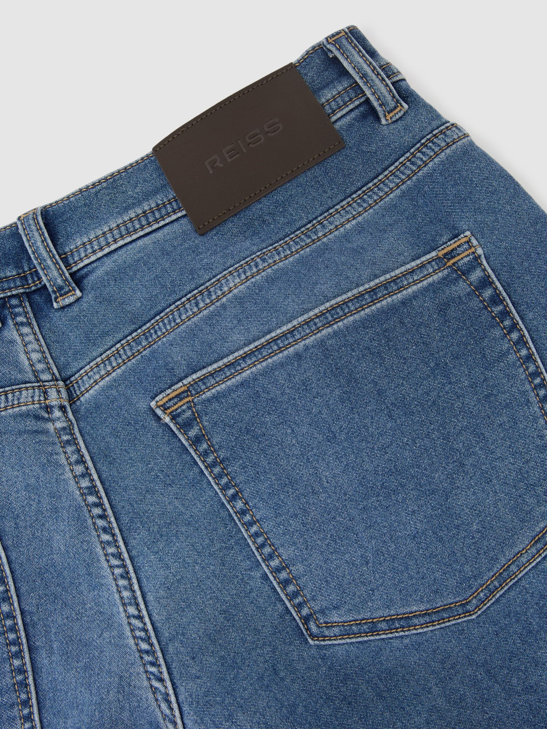 Soft-Stretch Straight-Leg Jeans in Light Wash Blue - image 3
