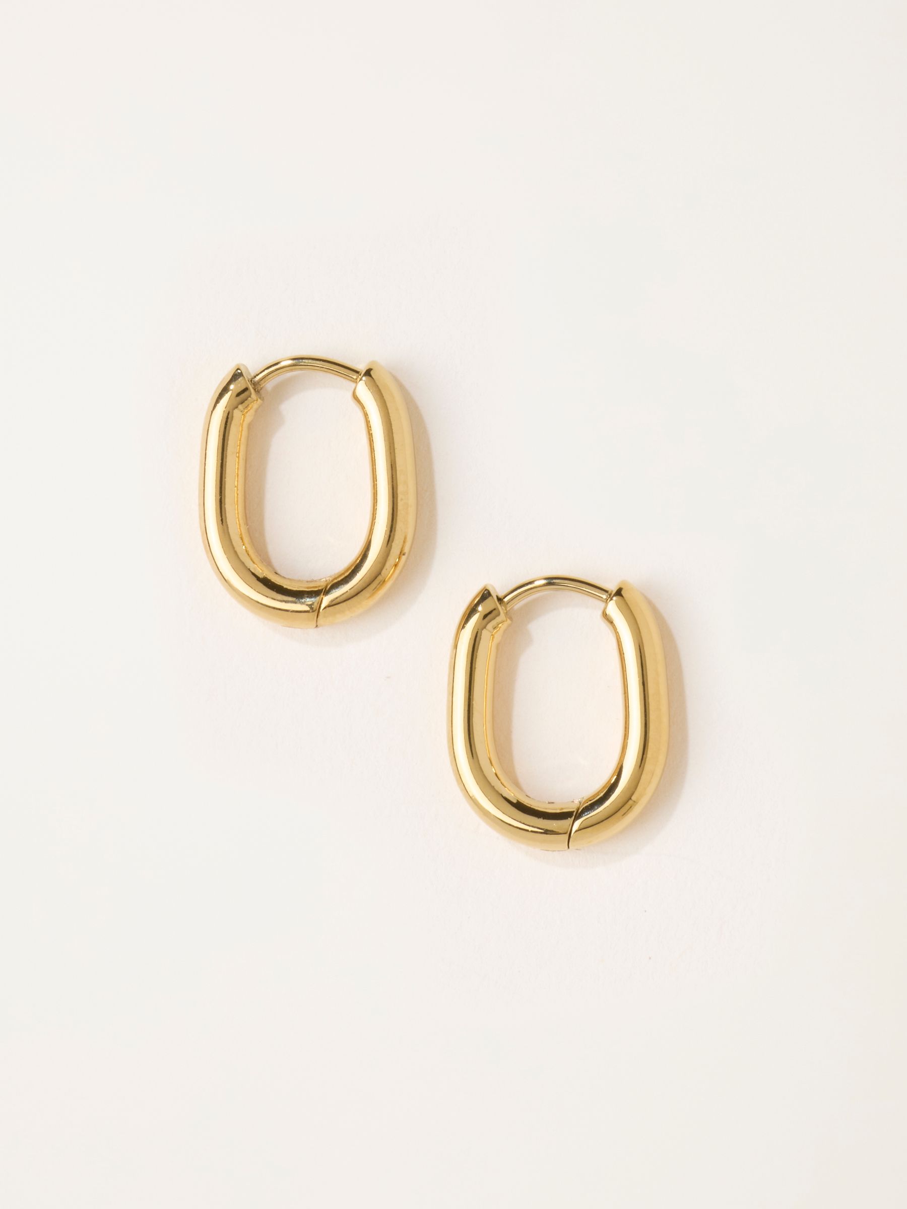 Gold Tone Waterproof Oval Hoops - Image 1 of 2 Gold Tone Waterproof Oval Hoops - Image 1 of 2