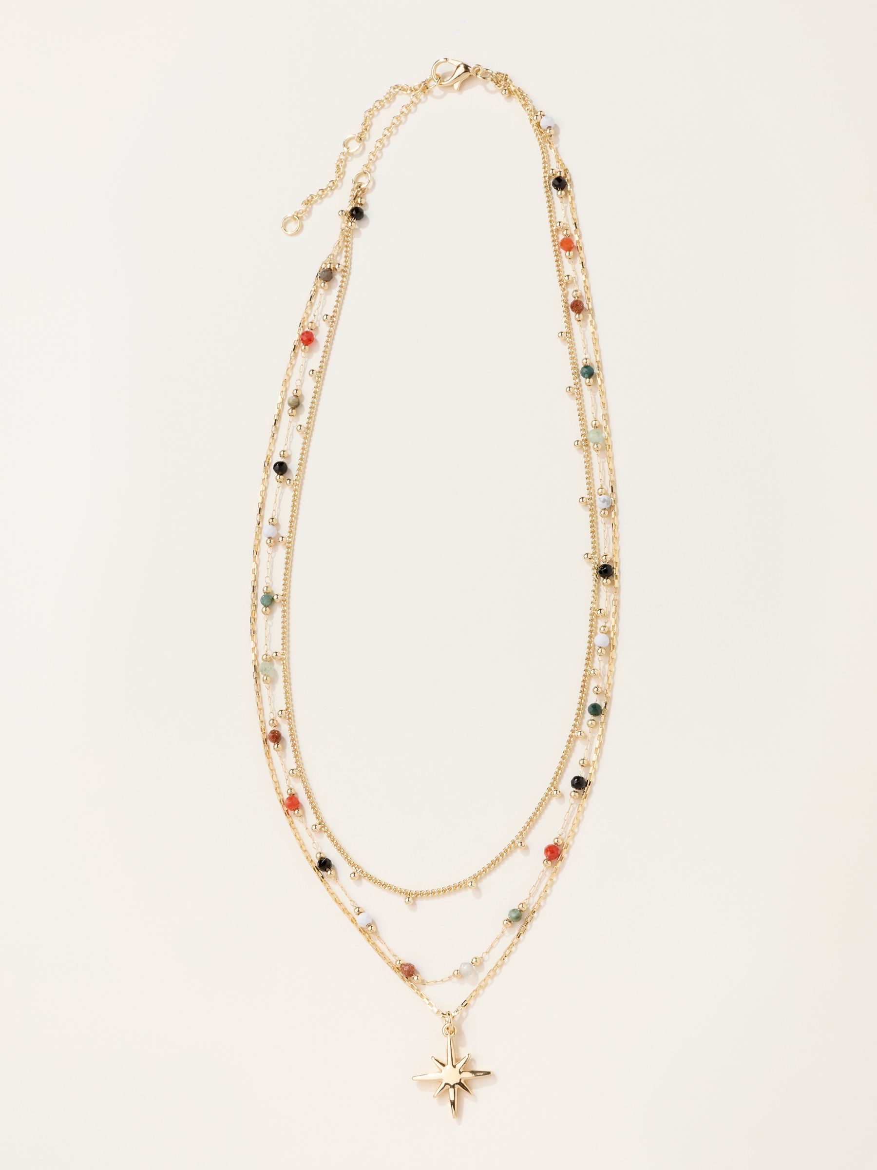 Gold Tone Layered Star Necklace - Image 1 of 2 Gold Tone Layered Star Necklace - Image 1 of 2