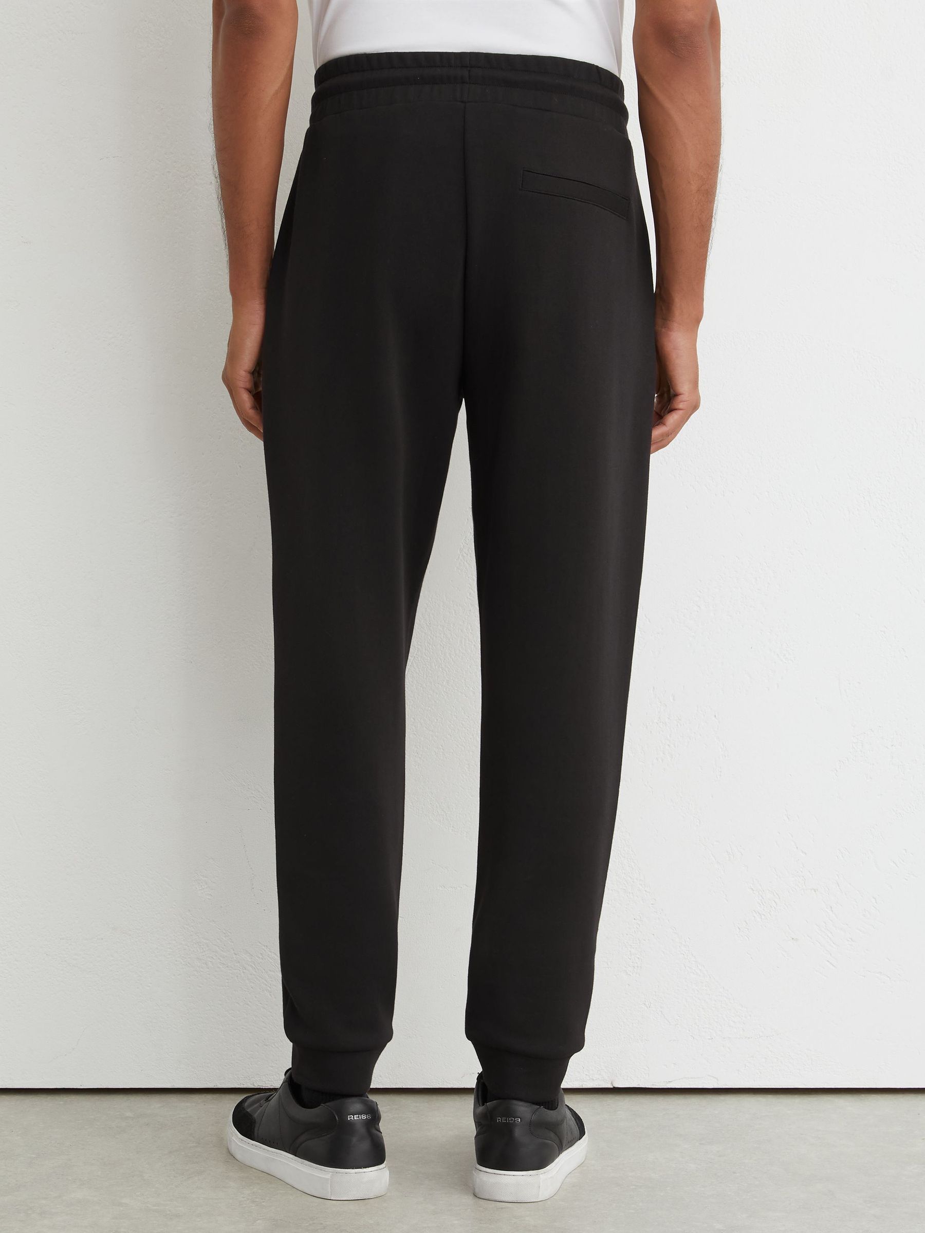 Premium Interlock Cuffed Joggers in Black - Image 5 of 6