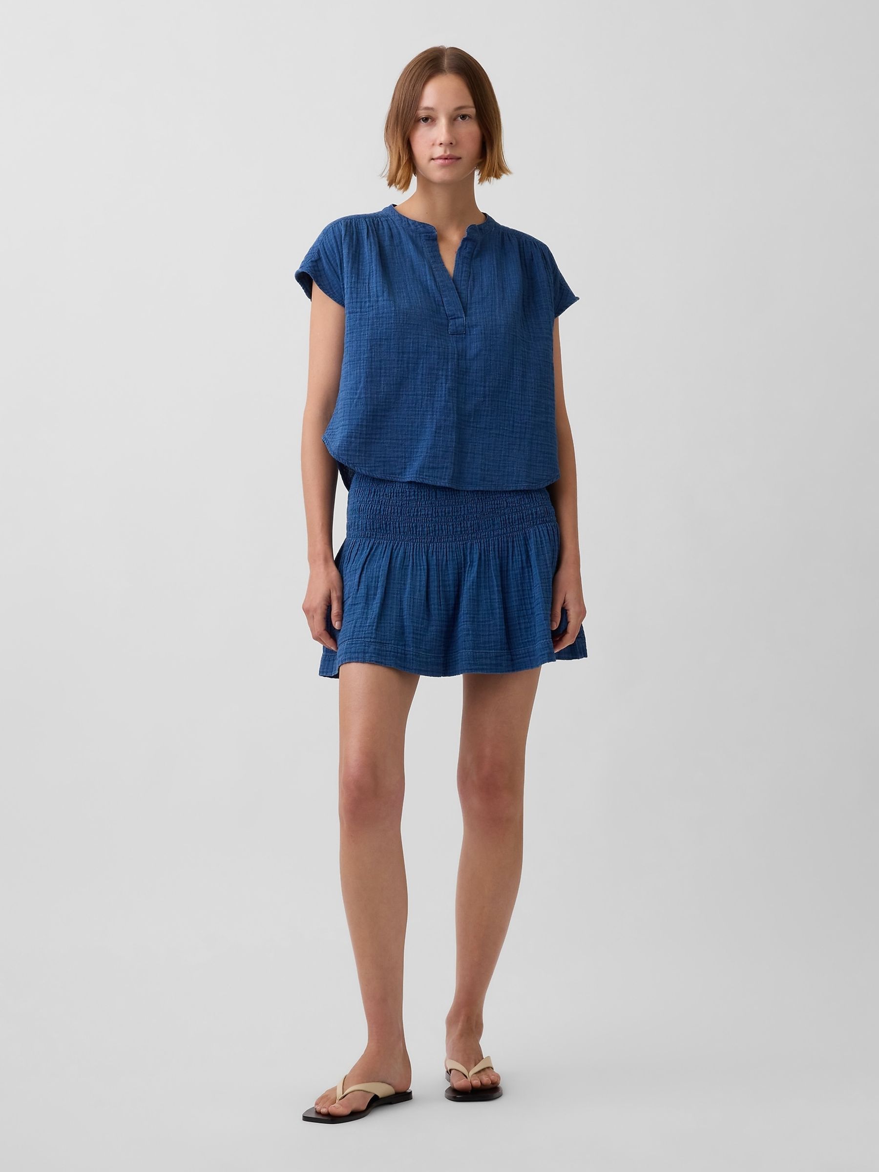 Blue Gauze Denim Smocked Waist Mini Skort - Image 1 of 5 Blue Gauze Denim Smocked Waist Mini Skort - Image 1 of 5