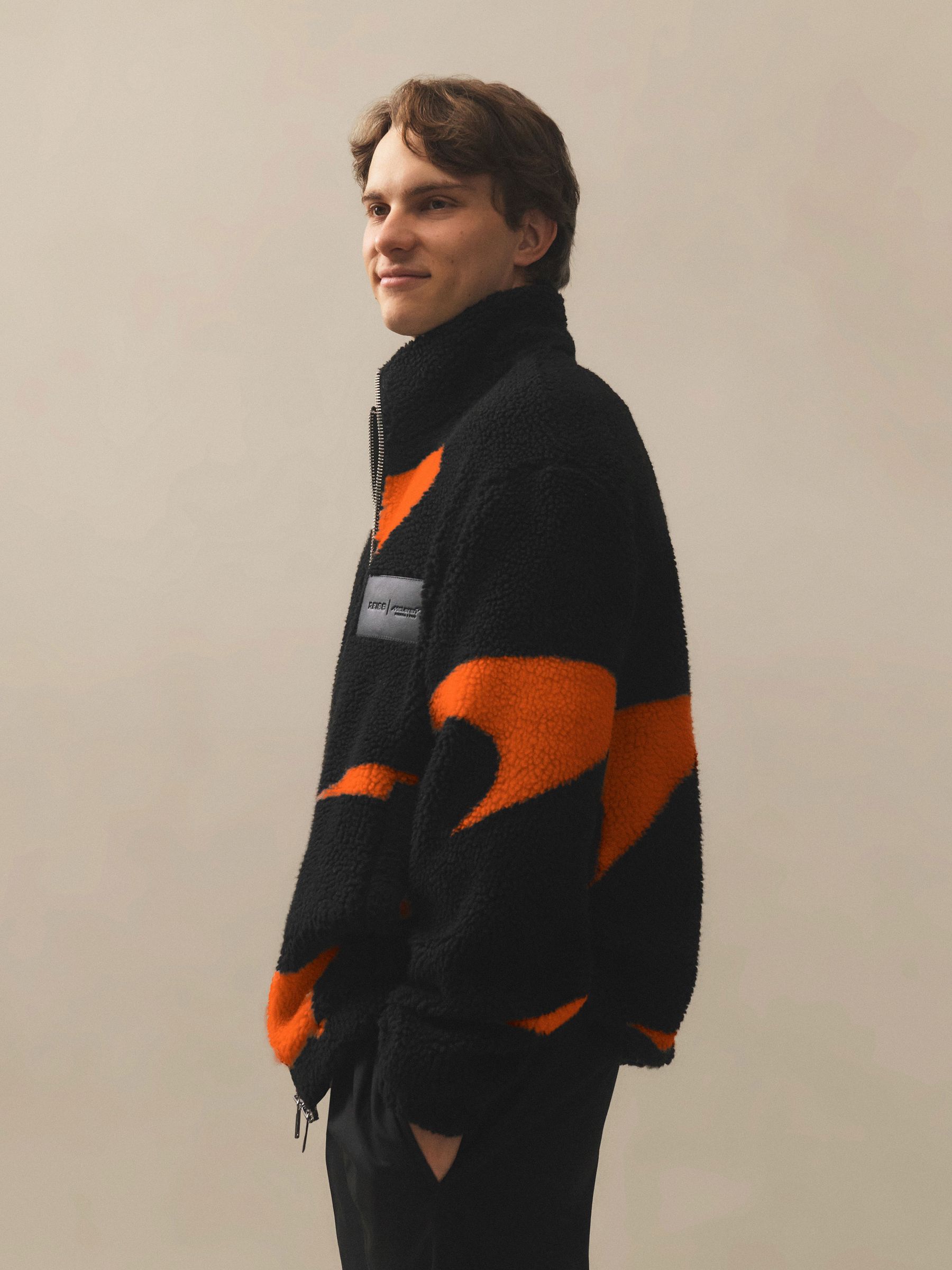 McLaren Racing Speedmark Fleece Jacket Unisex-Fit in Black/Papaya Orange - Image 1 of 9