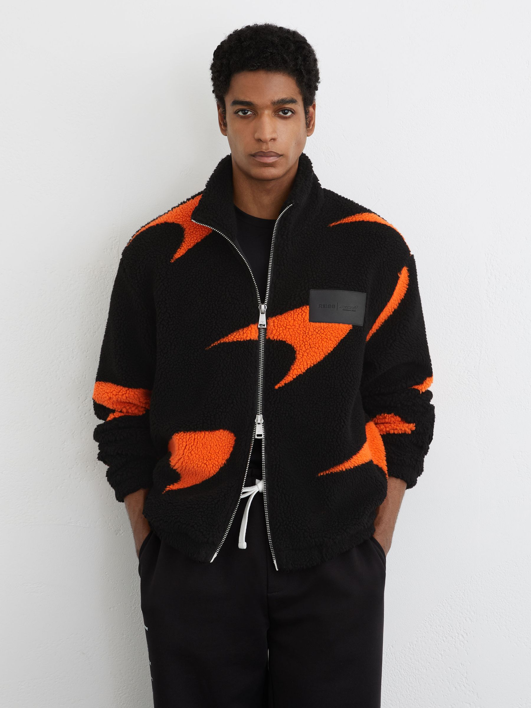 McLaren Racing Speedmark Fleece Jacket Unisex-Fit in Black/Papaya Orange - Image 3 of 9