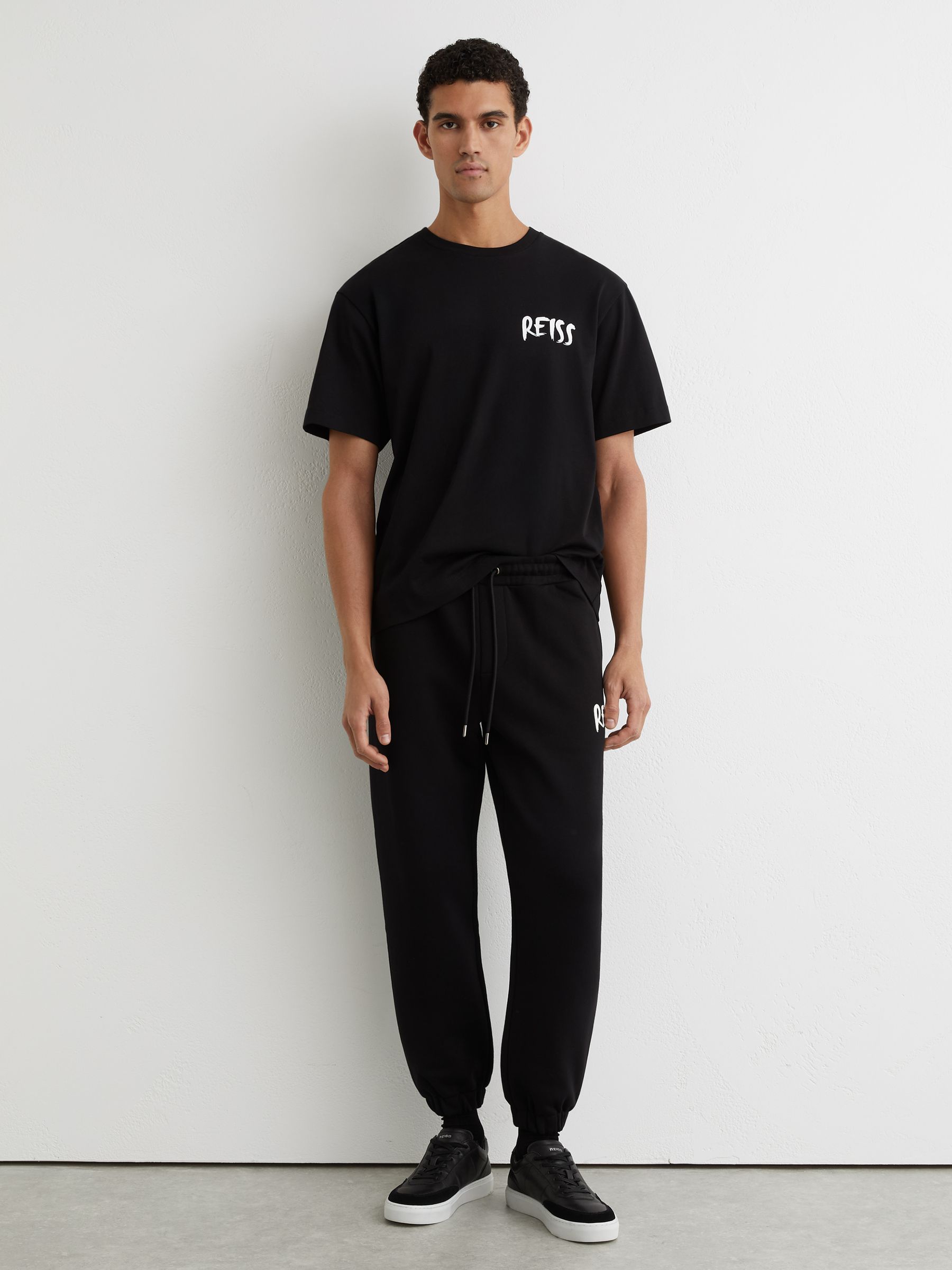 Cotton Logo-Print Cuffed Joggers in Black - image 2