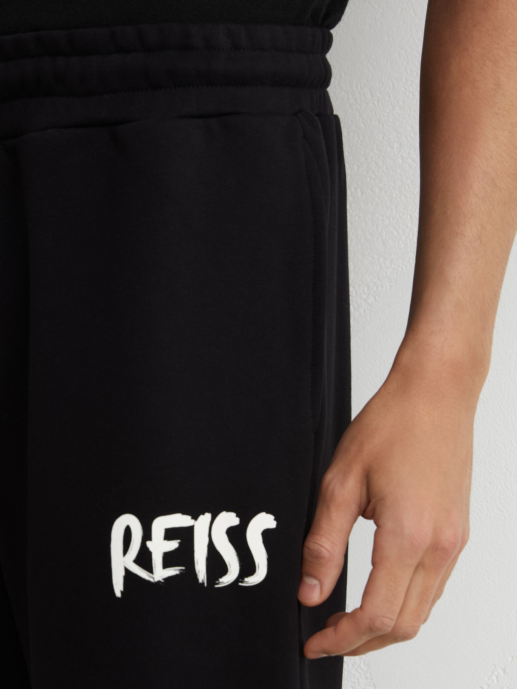 Cotton Logo-Print Cuffed Joggers in Black - Image 3 of 6