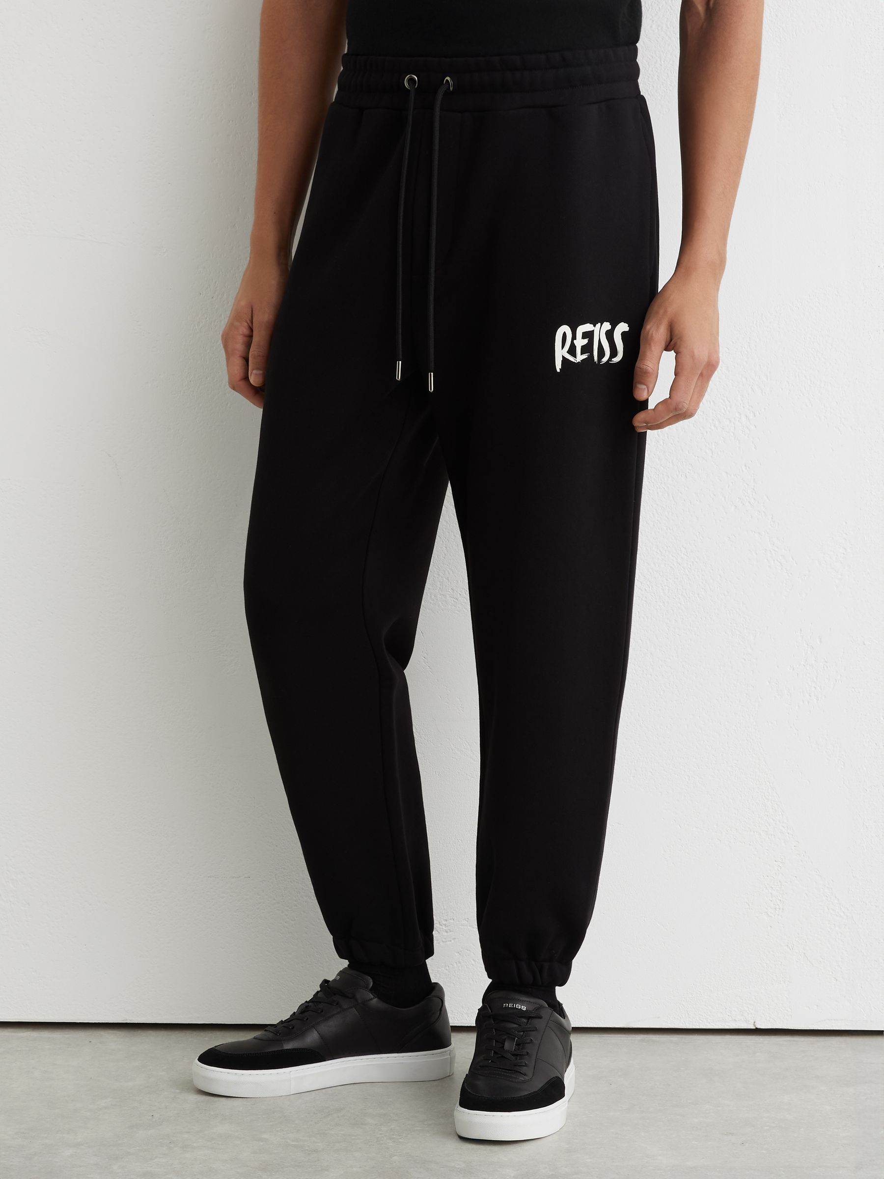 Cotton Logo-Print Cuffed Joggers in Black - Image 4 of 6