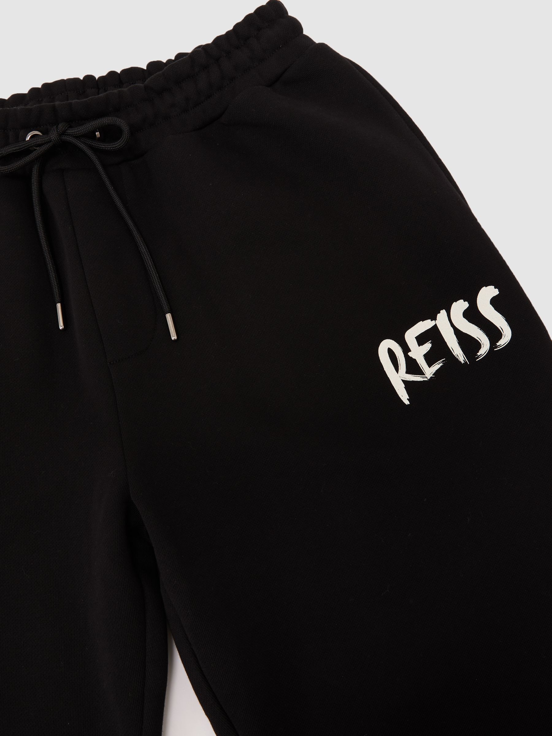 Cotton Logo-Print Cuffed Joggers in Black - Image 6 of 6