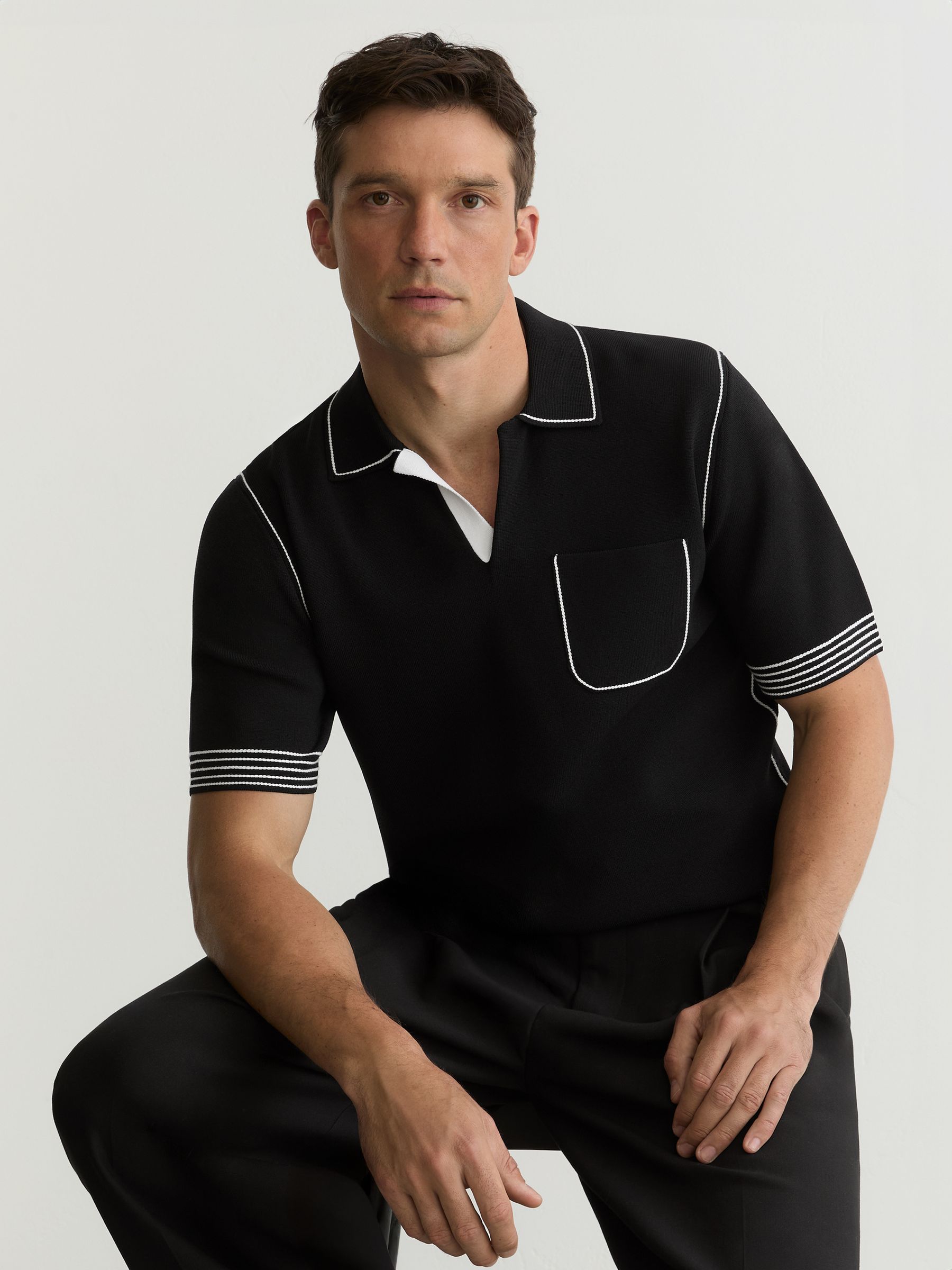 Contrast-Stitch Knitted Polo Shirt in Black - Image 1 of 6