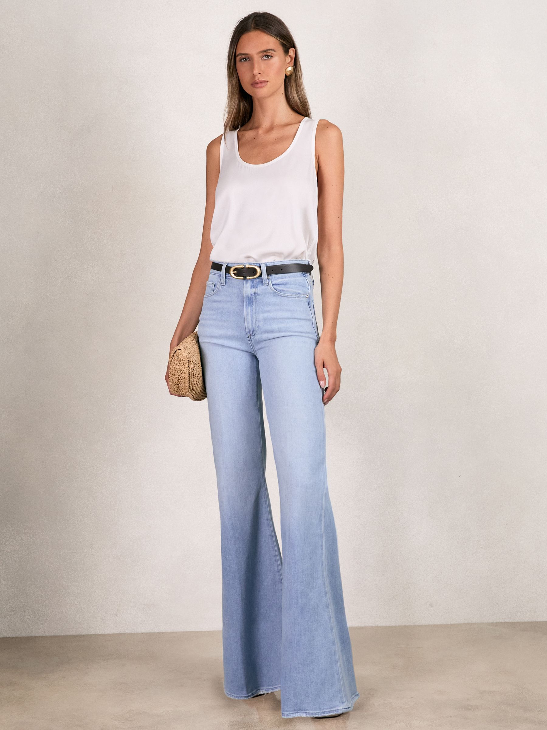 Paige Mid-Rise Flared Jeans in Light Blue - Image 1 of 5