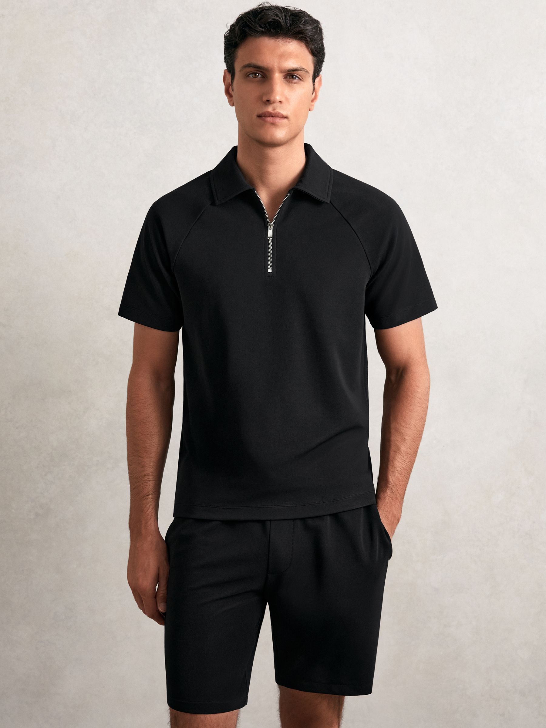 Textured Raglan Half-Zip Polo Shirt in Black - Image 1 of 6