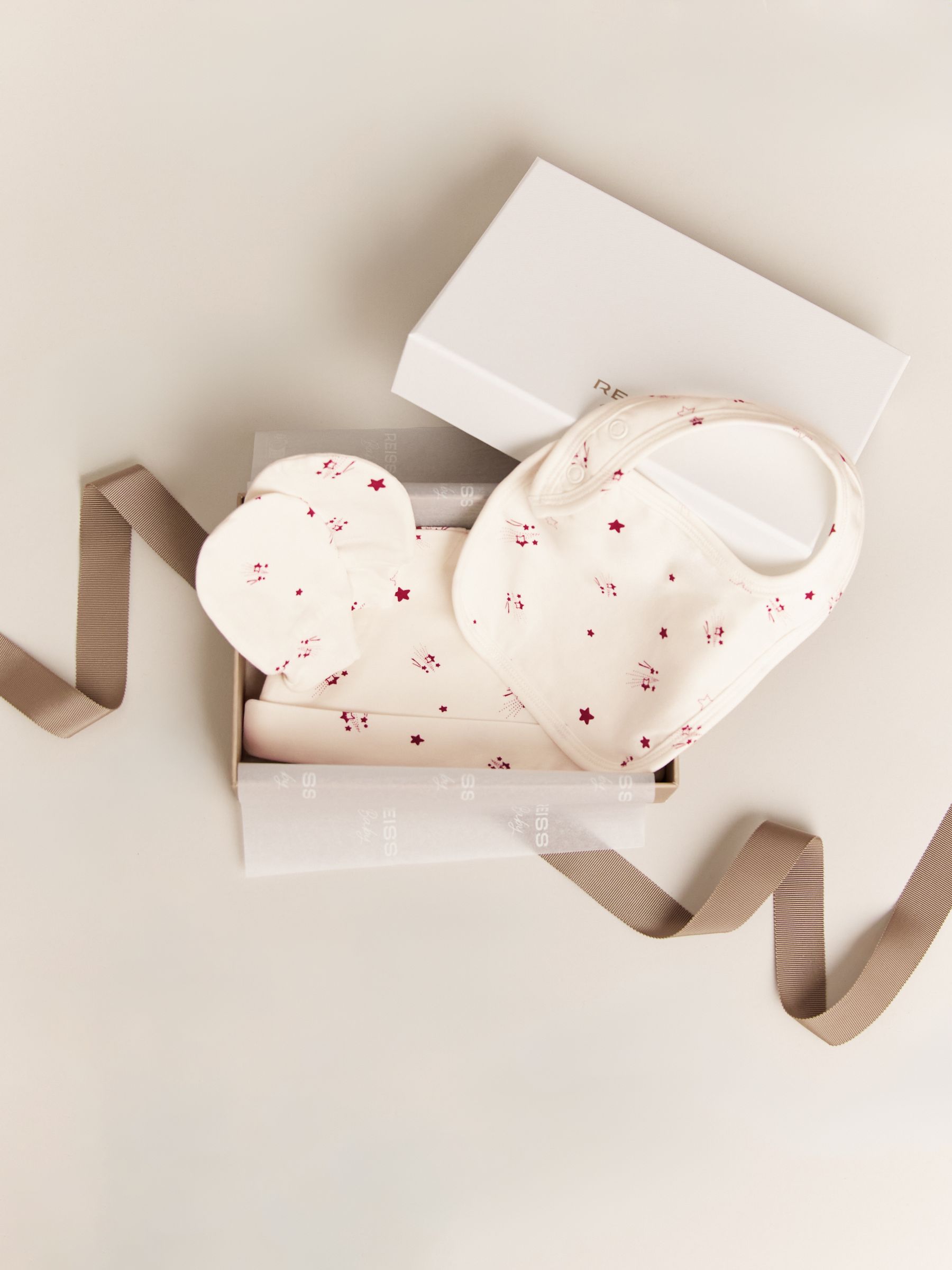 Hat, Bib And Mittens Set in Ivory Print - Image 1 of 3