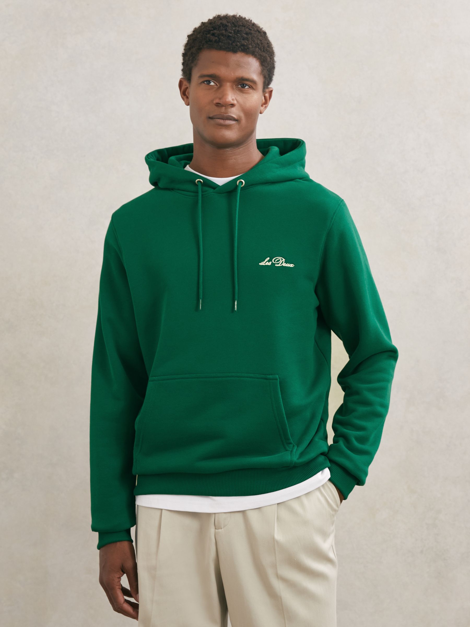 Les Deux Cotton Artwork-Print Hoodie in Evergreen - Image 1 of 5 Les Deux Cotton Artwork-Print Hoodie in Evergreen - Image 1 of 5