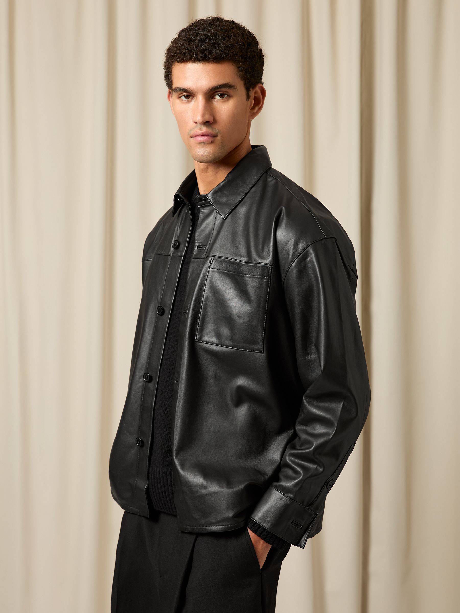 Monogram Embossed Leather Jacket Relaxed-Fit in Black - Image 1 of 6