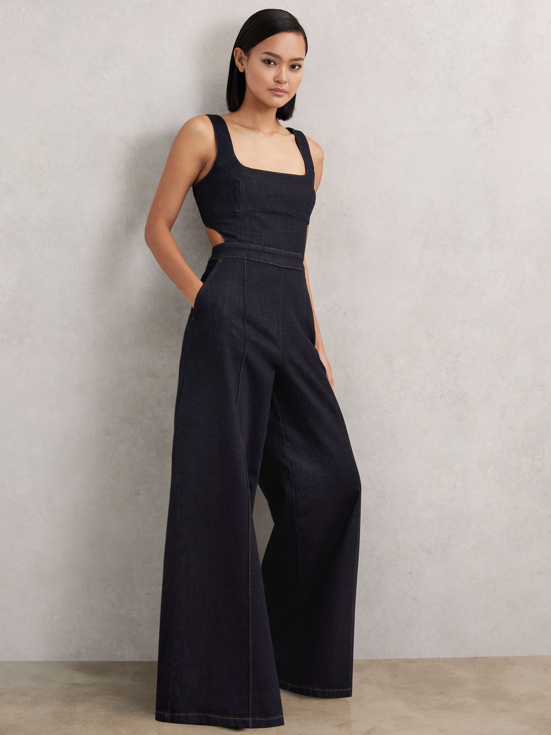 Denim-Jumpsuit mit weitem Beinausschnitt und Cut-Outs in Dunkelblau - Bild 4 von 7