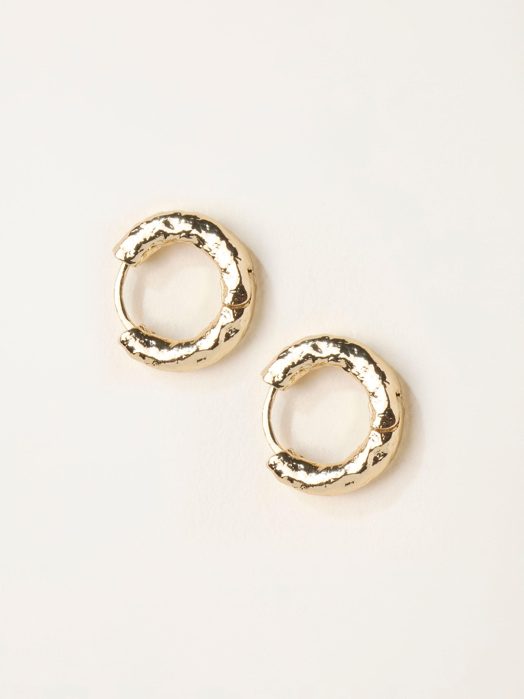 Gold Tone Hammered Hoop Earrings - Image 1 of 2