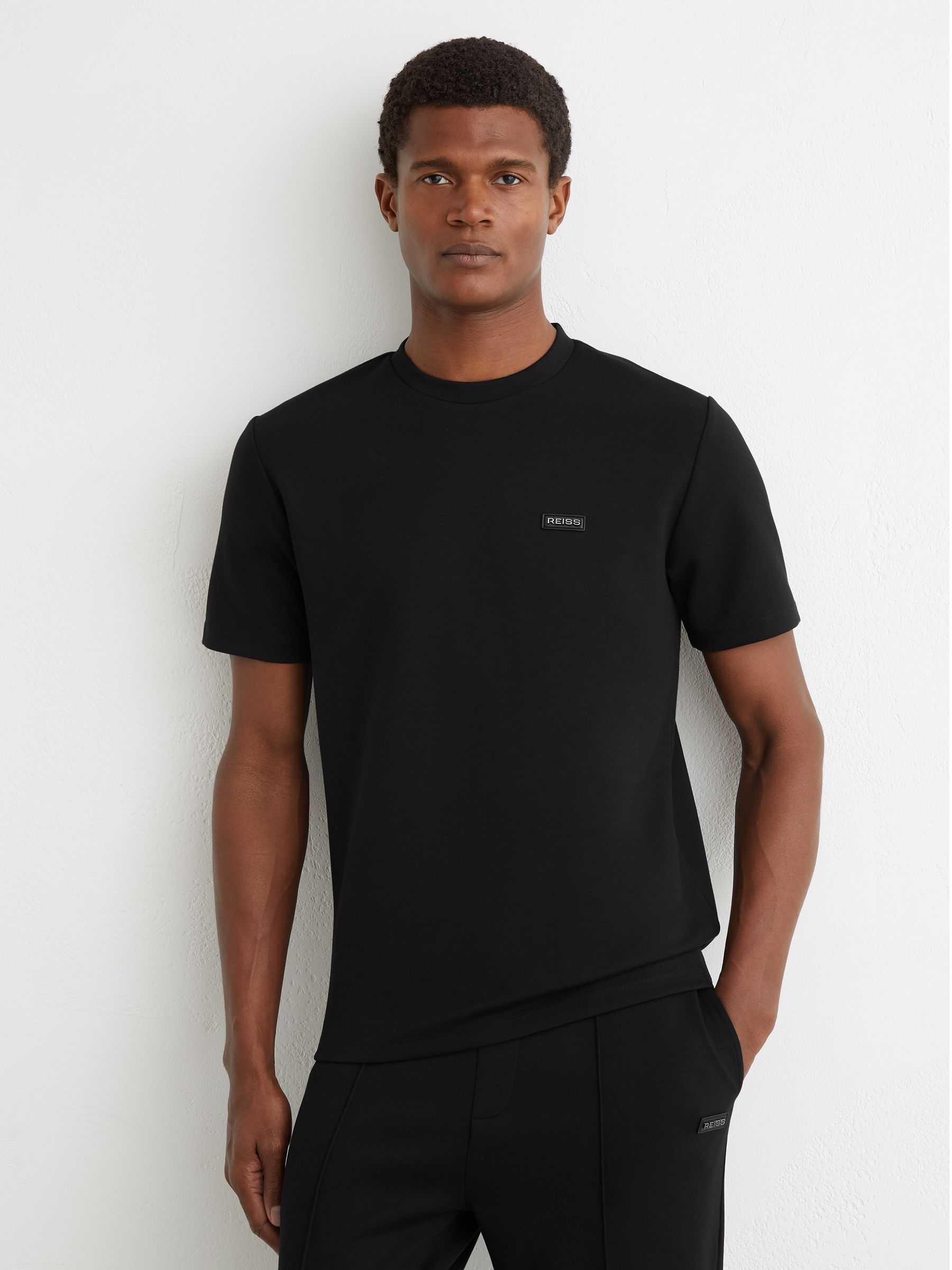 Premium Interlock Logo T-Shirt in Black - Image 1 of 6 Premium Interlock Logo T-Shirt in Black - Image 1 of 6