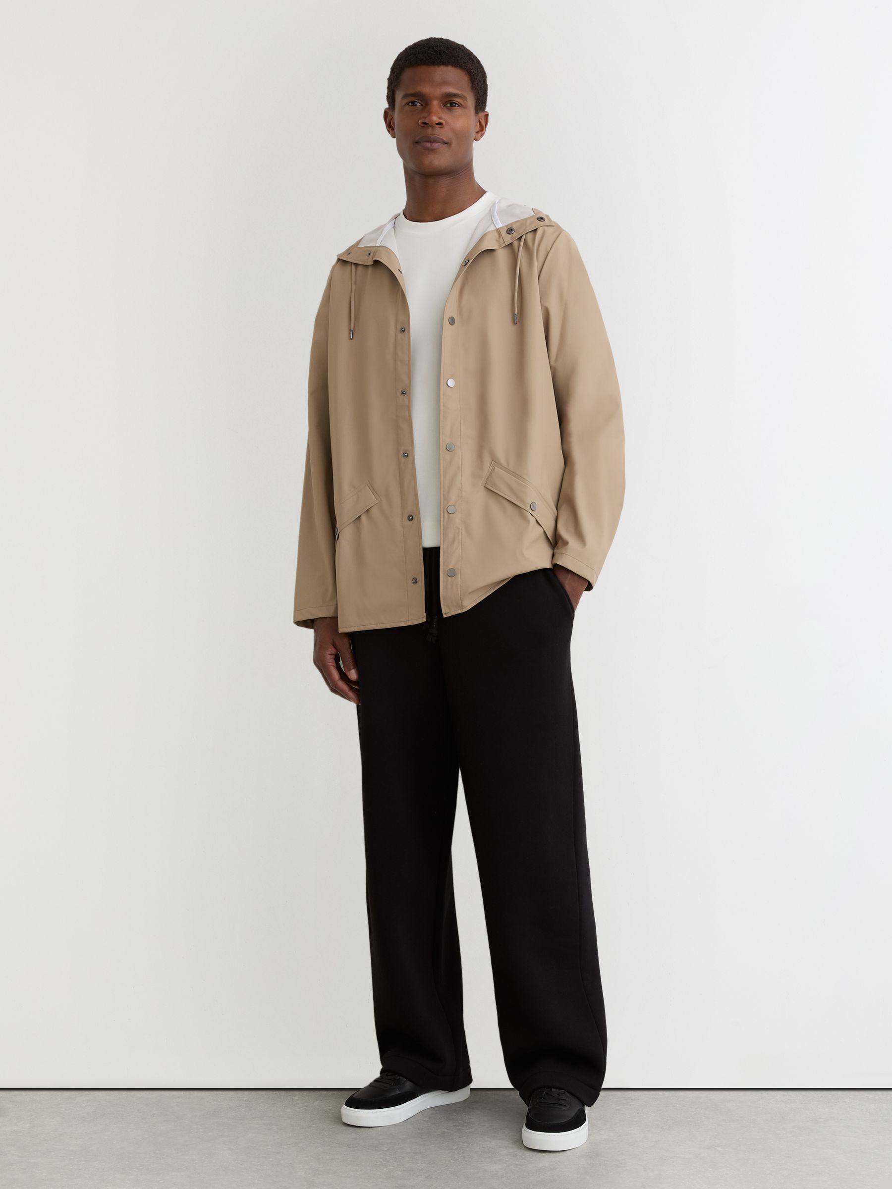 Rains Waterproof Hooded Rain Jacket in Beige - Image 1 of 5