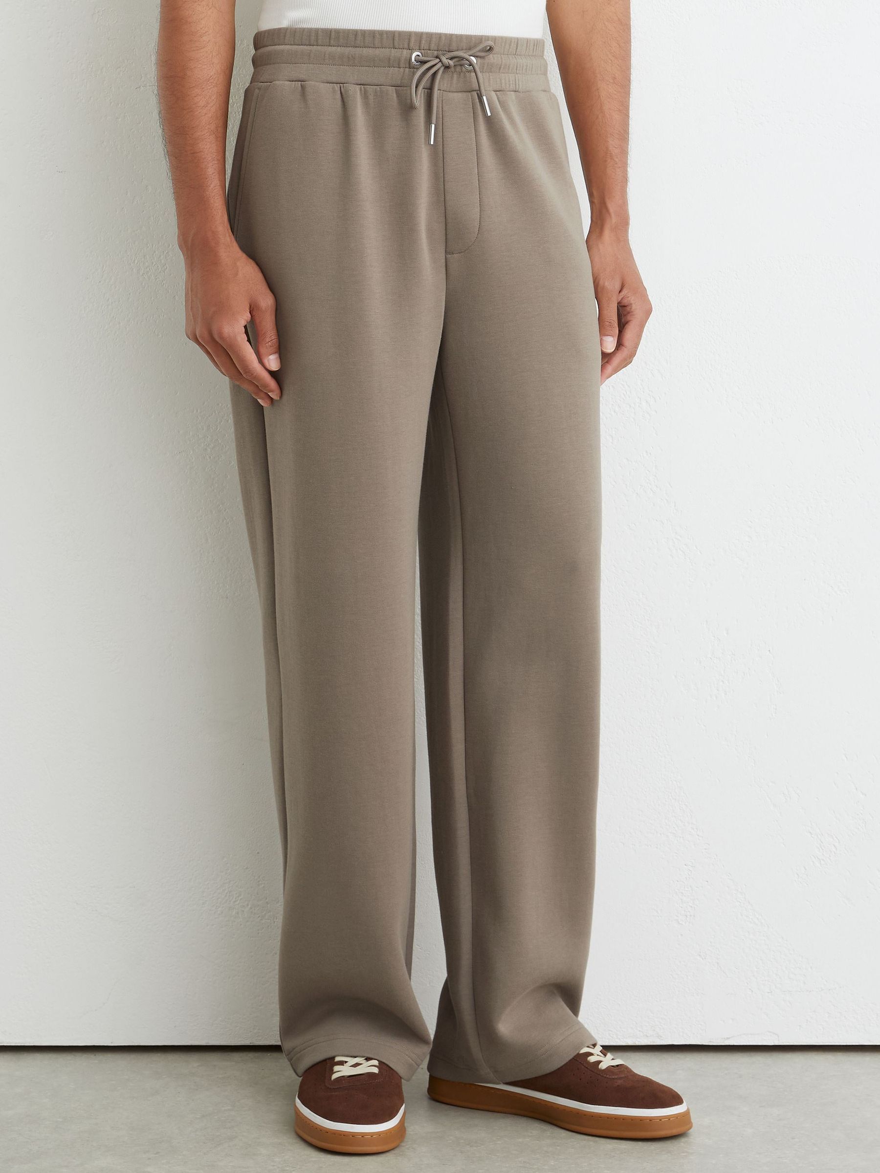 Premium Interlock Relaxed-Fit Joggers in Mushroom Brown - Image 1 of 5 Premium Interlock Relaxed-Fit Joggers in Mushroom Brown - Image 1 of 5
