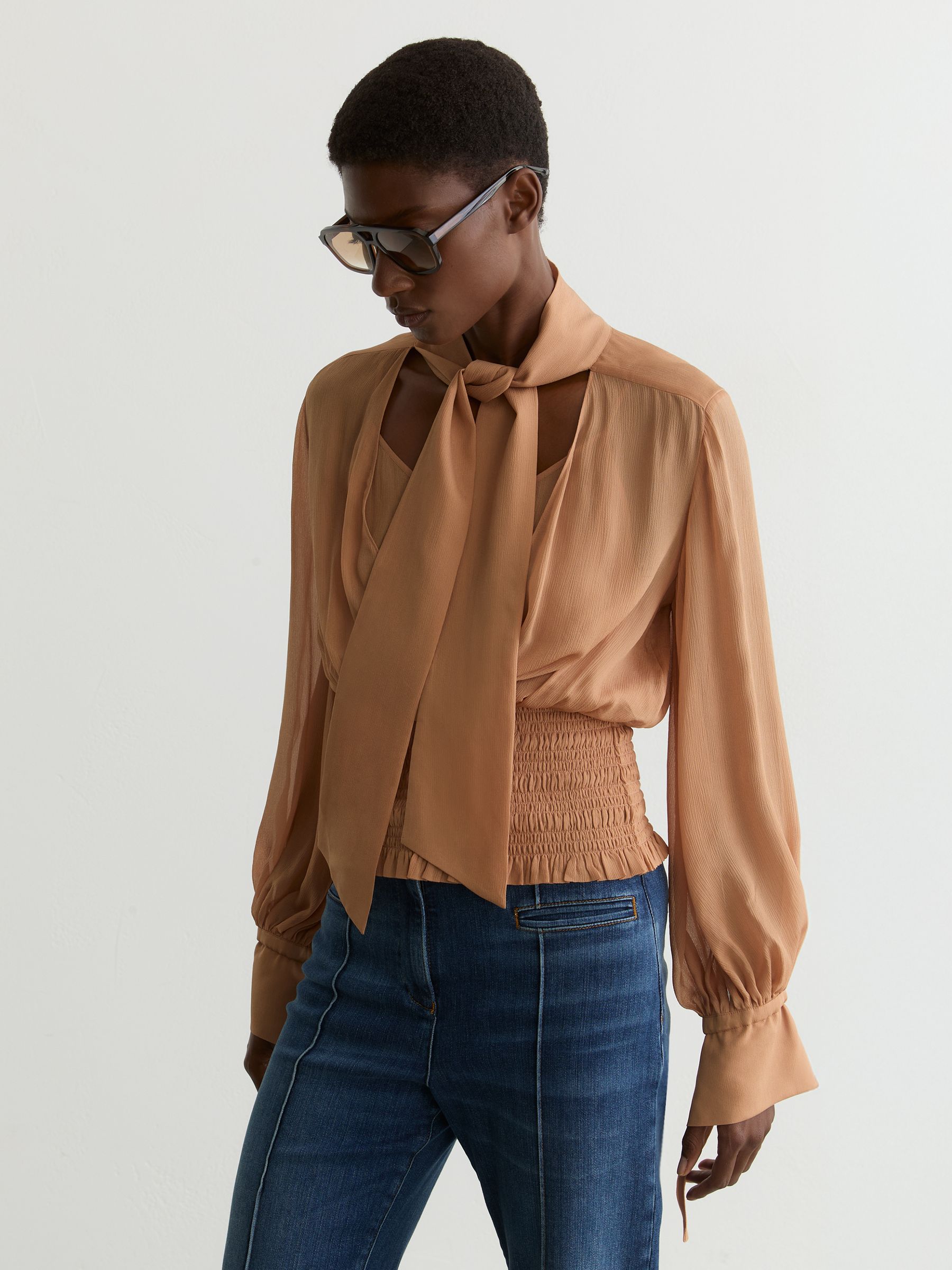 Sheer Tie-Neck Shirred Blouse in Rust Orange - Image 1 of 7