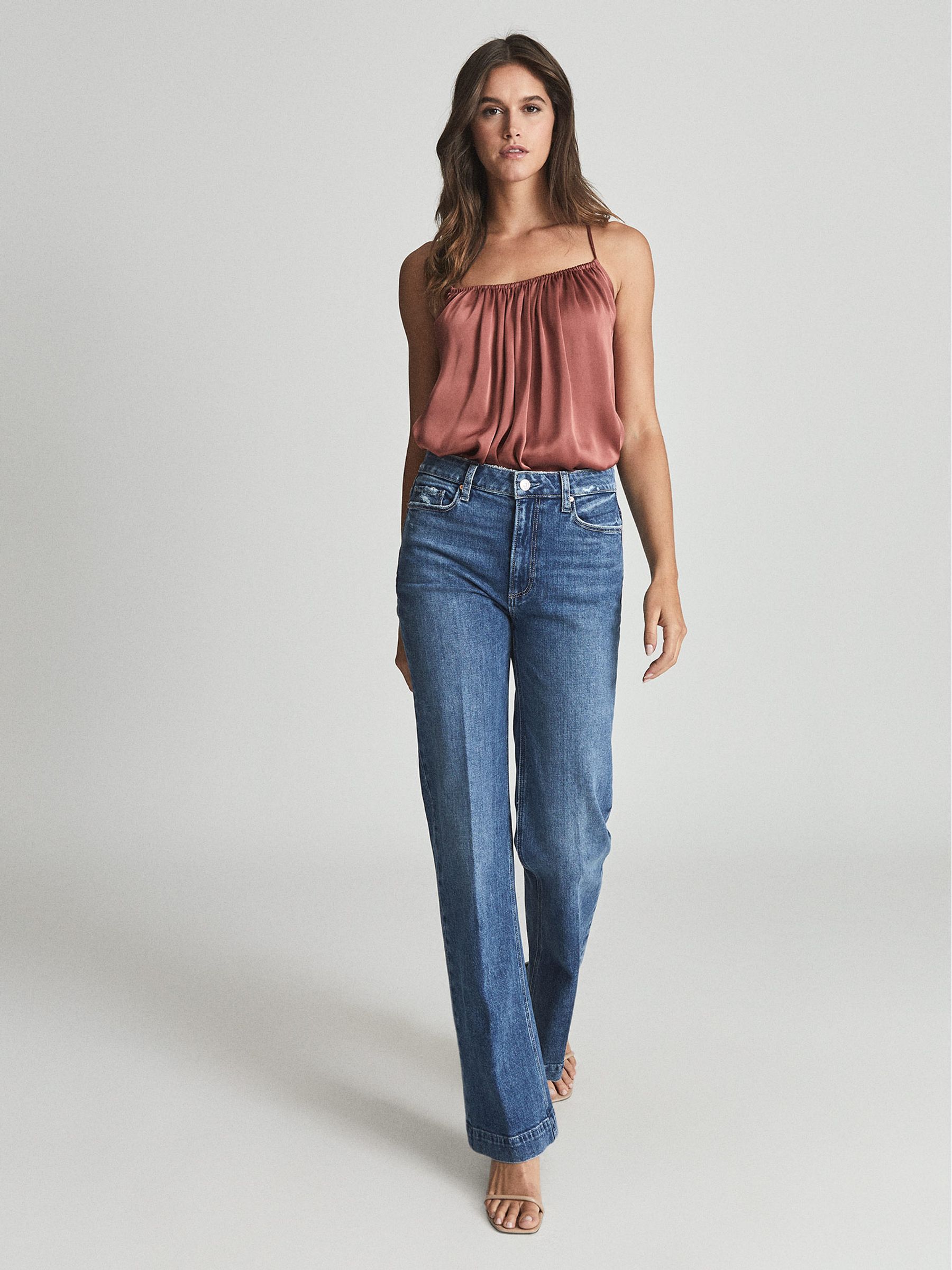 Paige High Rise Flared Jeans in Mid Blue - REISS
